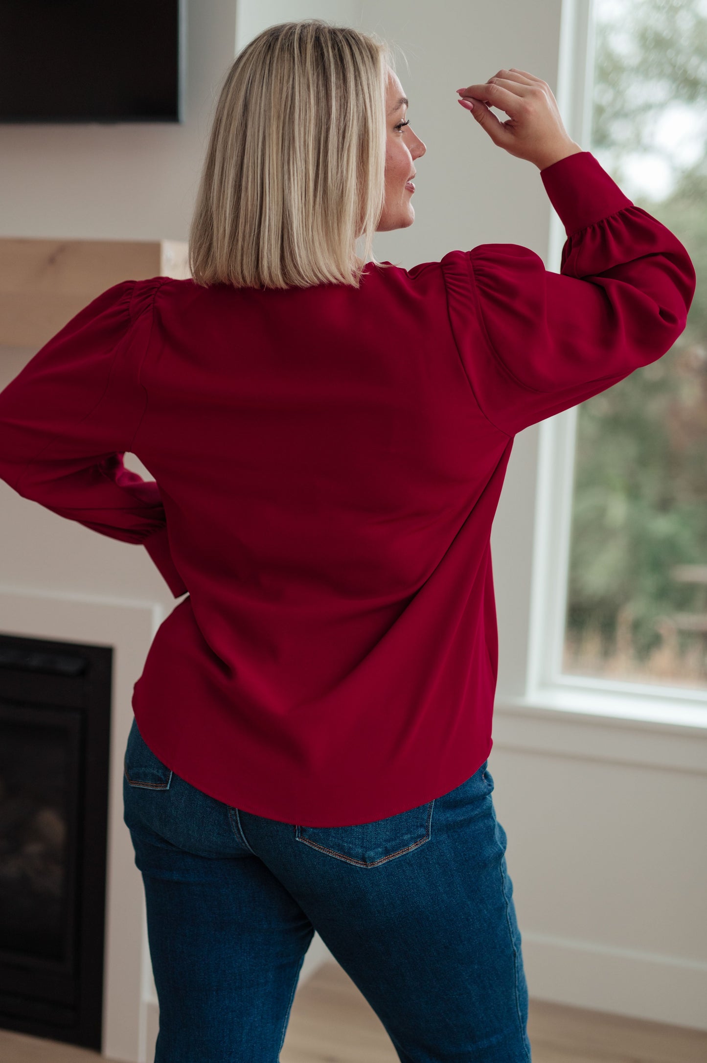 Back profile of plus size Birdie V-Neck Blouse in rich wine, lightweight drape.