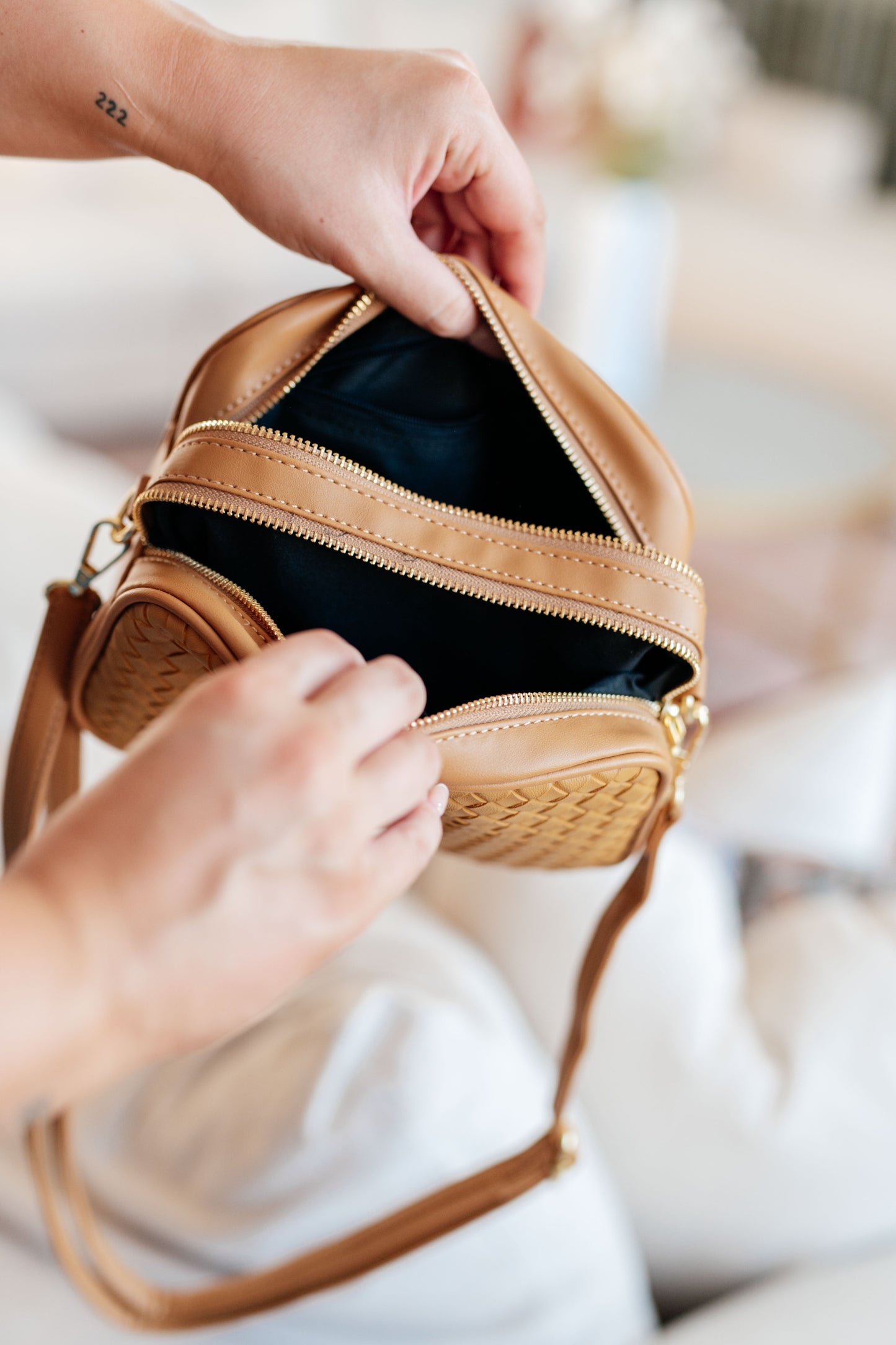 Golden Hour Crossbody with both compartments open, showing spacious interior and multiple pockets.