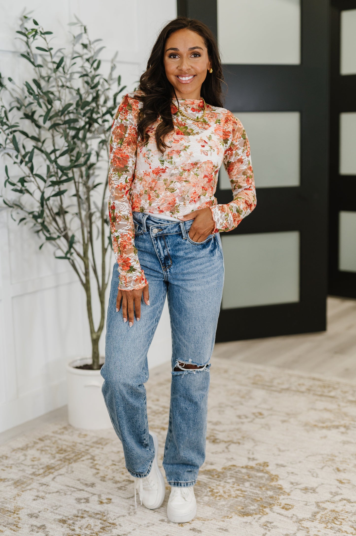 Inclusive sizing lace top in coral with floral print and flirty lettuce hem, shown on diverse body types.