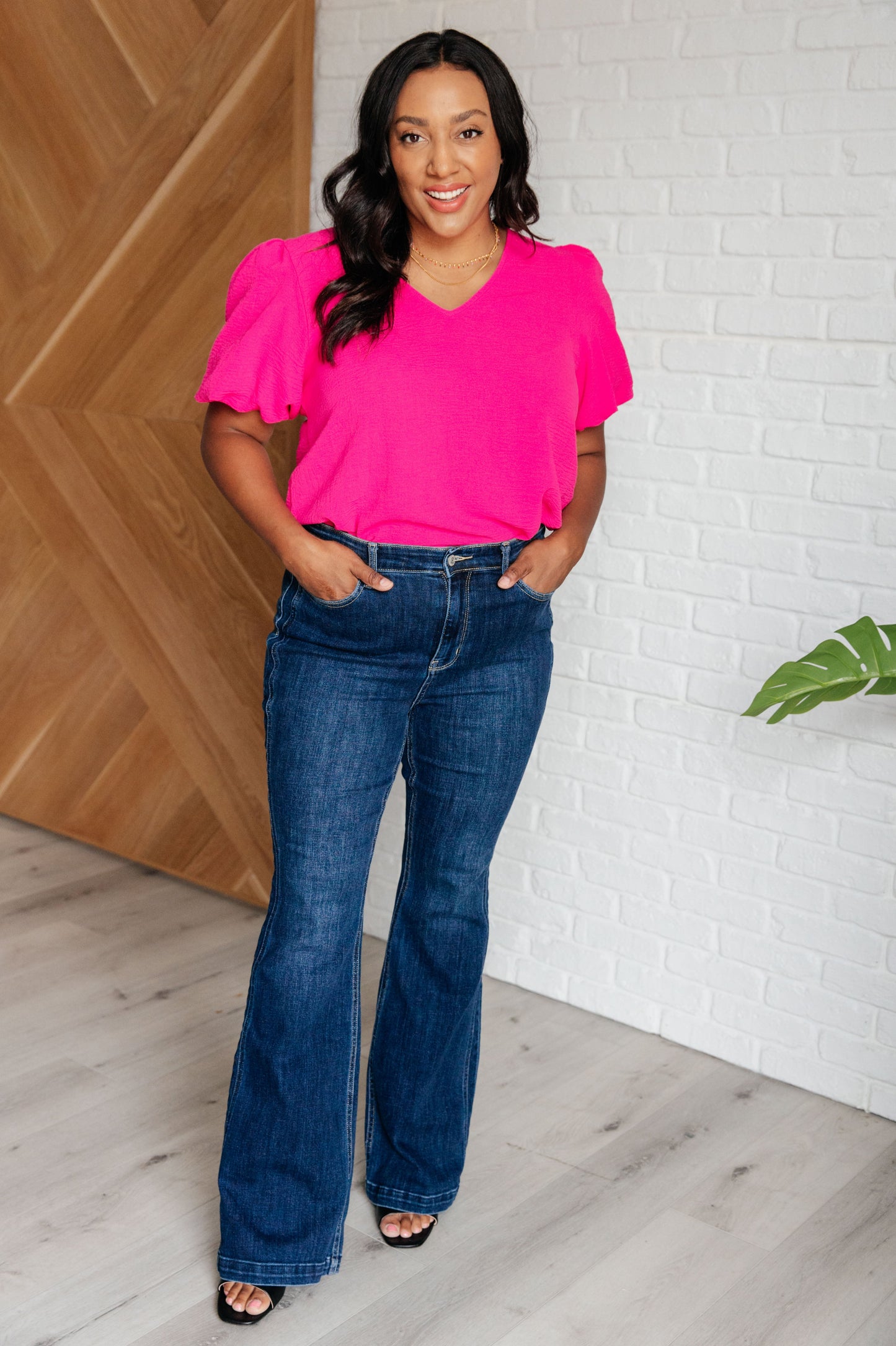 Plus size crinkle woven Belle Puff Sleeve Blouse in hot pink with feminine v-neck and playful balloon sleeves.