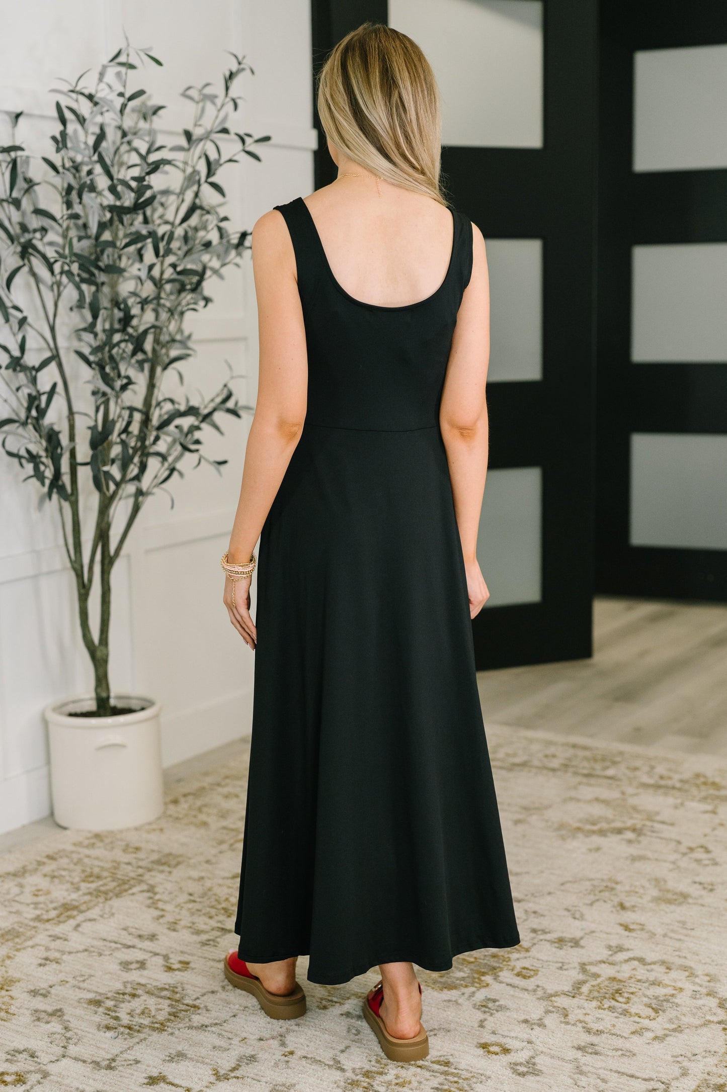 Betsy Maxi Dress black, back view A-line silhouette with pockets.