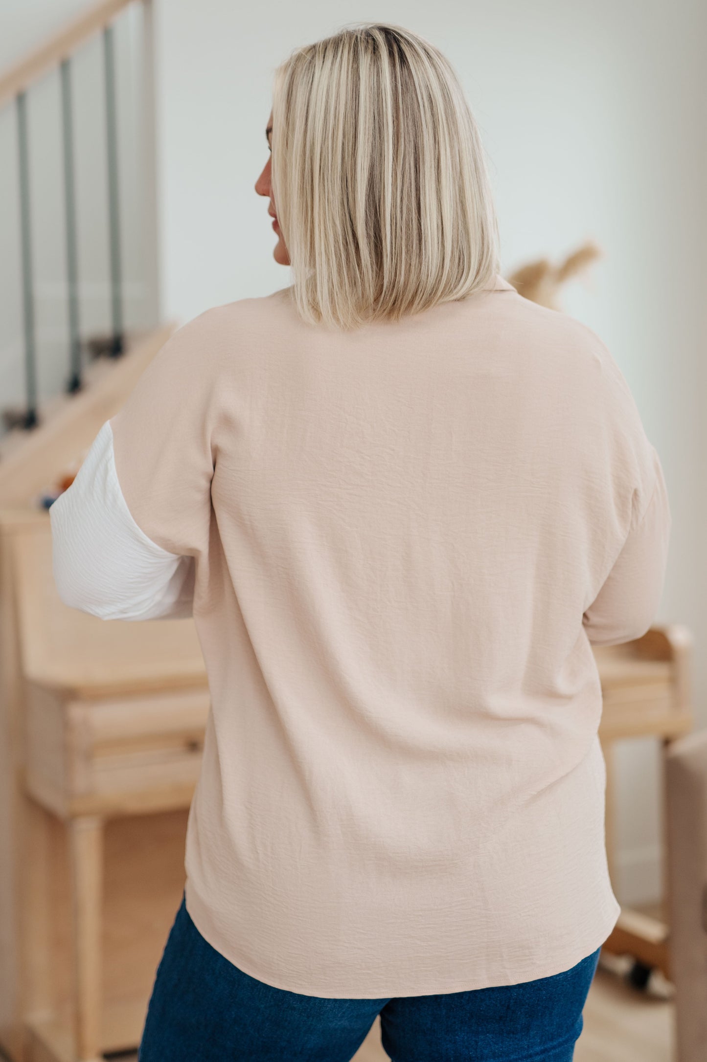 Plus-size model back view of Hadley Button Down, ivory and taupe color block, relaxed silhouette, long sleeves.