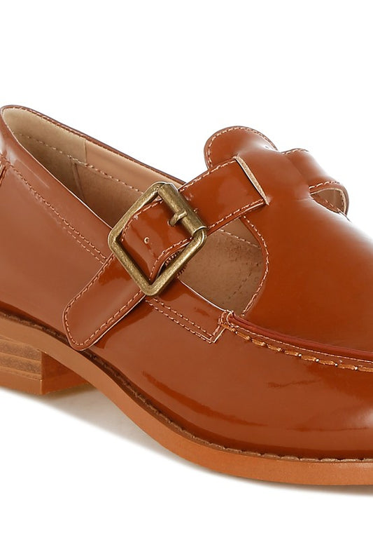 Close up of brown Swenson Mary Jane Loafers showing cushioned insole, glossy patent pleather finish, and stitch details