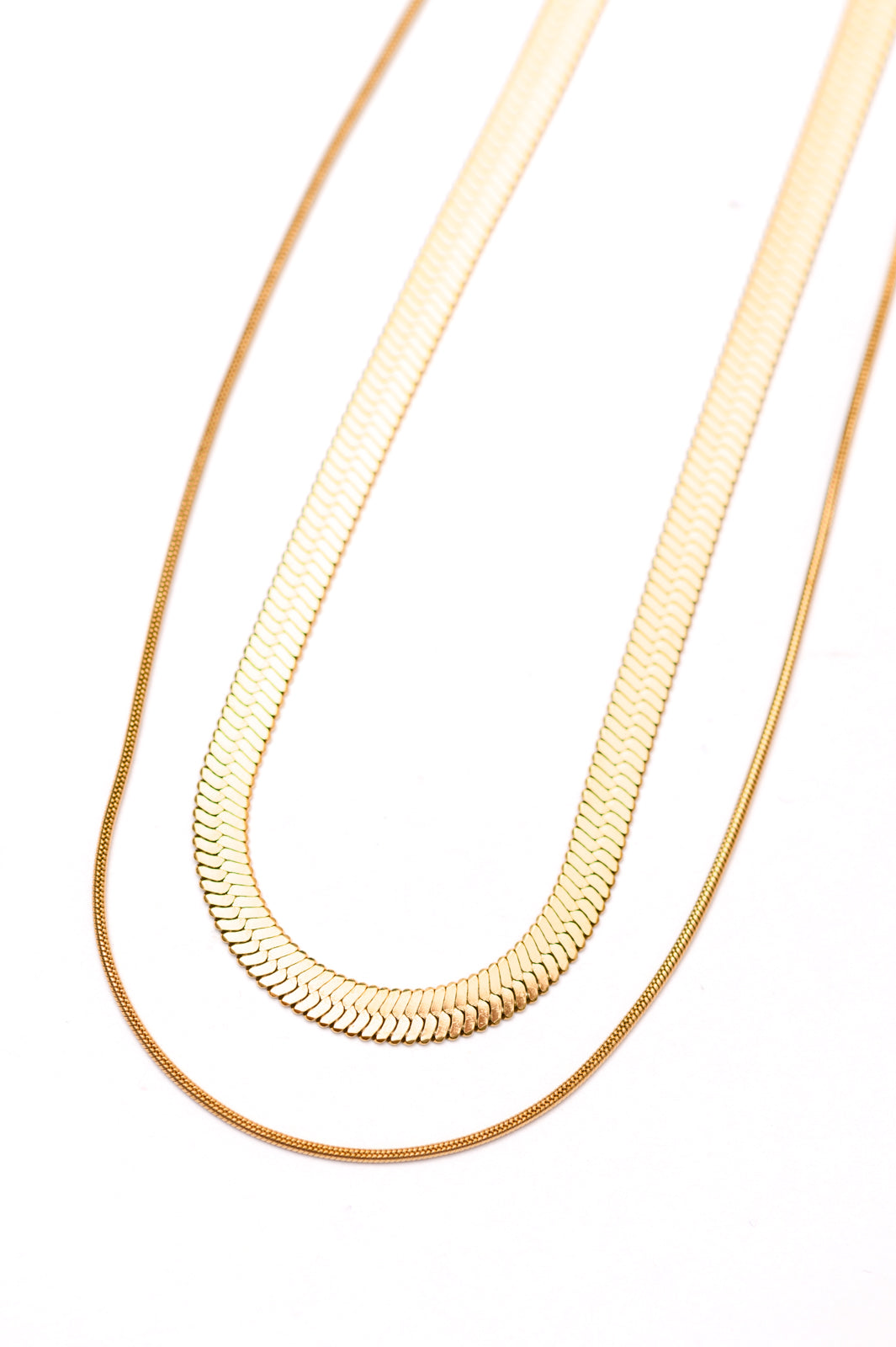 Noontide Double Chain Necklace – Gold-Plated, Adjustable & Lightweight – A delicate gold-plated double-chain necklace featuring an adjustable length of approximately 18 inches. Designed to be lightweight, hypoallergenic, and water-resistant, this elegant piece is perfect for layering or wearing solo for a chic, minimalist look.