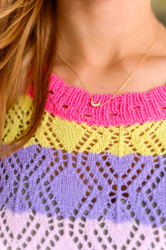 Closeup of woman wearing 925 sterling silver Over the Moon necklace with dainty moon charm.