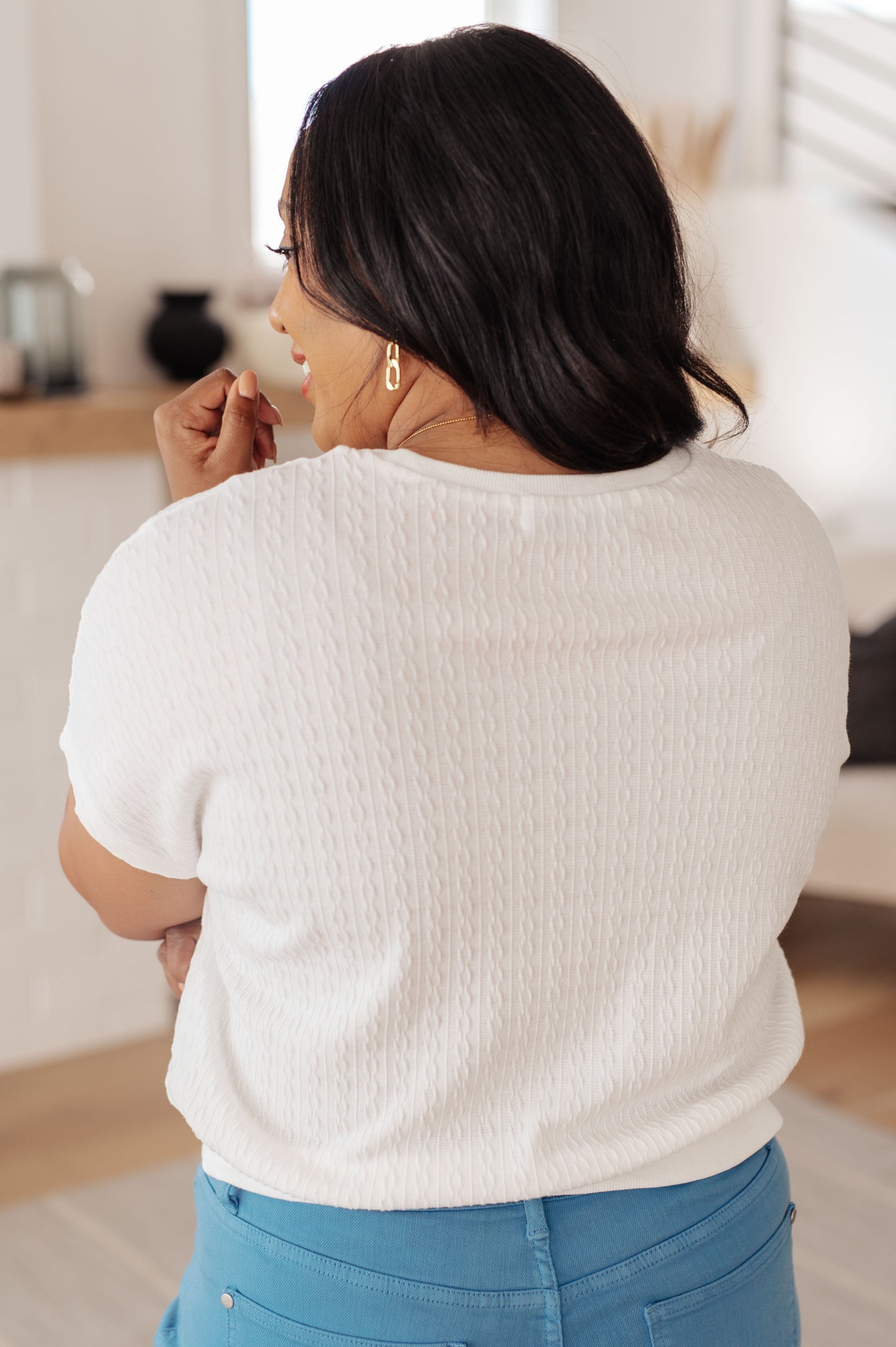 Plus size back view of Claudine white cable knit top with ribbed hemline and batwing short sleeves.