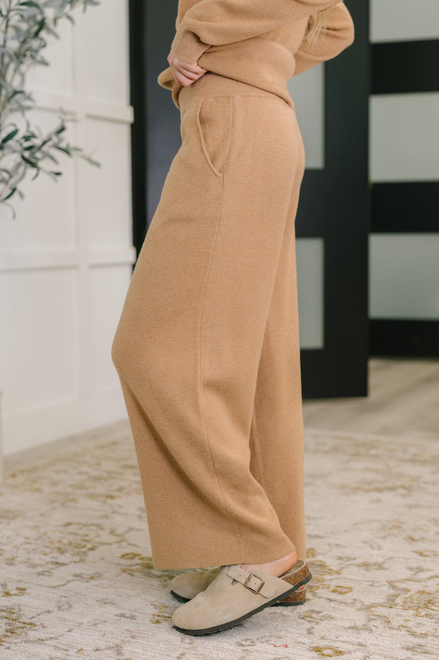 Side view of Clove Culottes in Camel showing cased elastic waistband and pockets