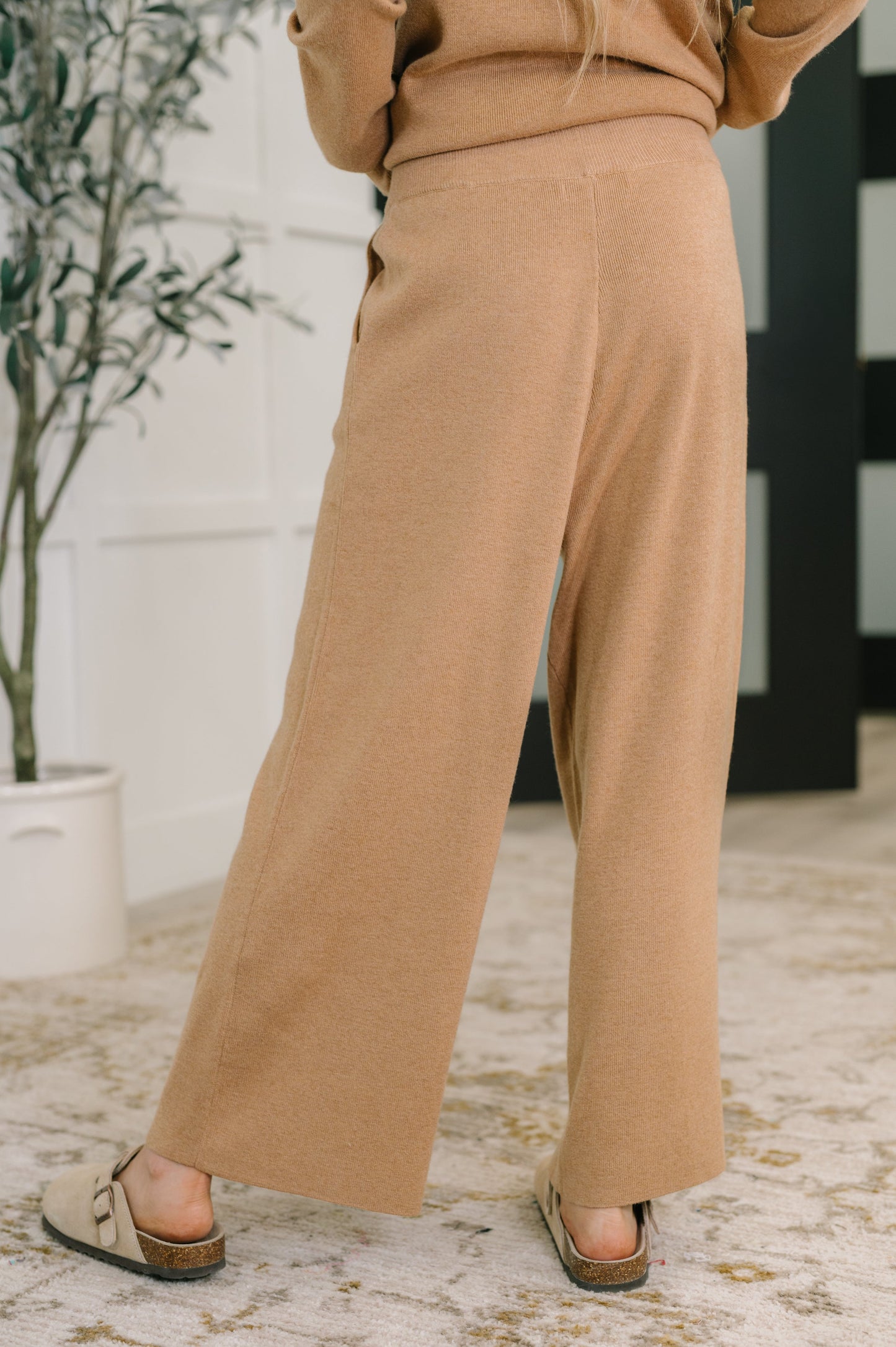 Back view of Clove Culottes in Camel highlighting wide leg fit and ribbed knit