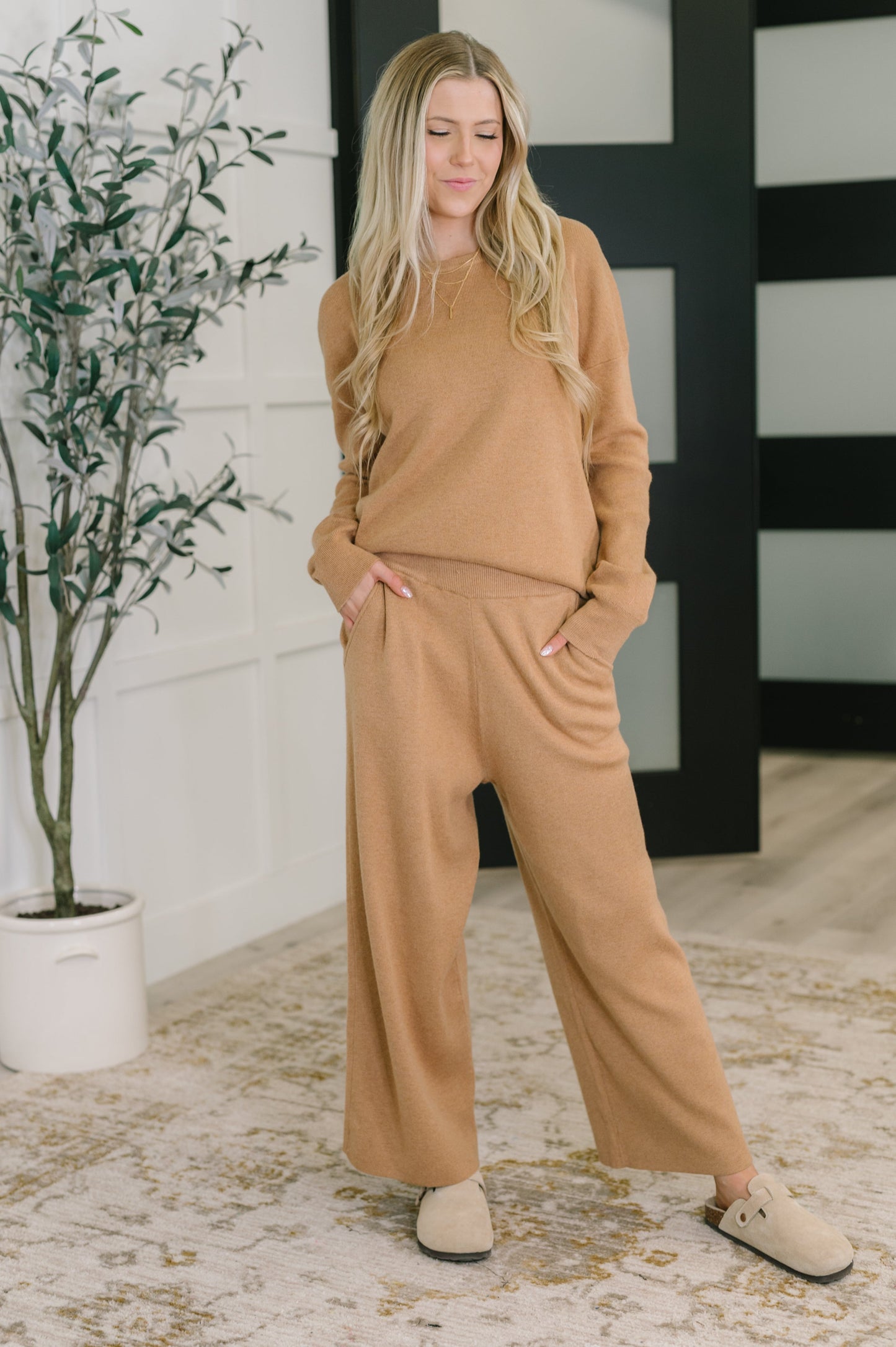 Full body view of model wearing Clove Sweater in Camel with matching culottes
