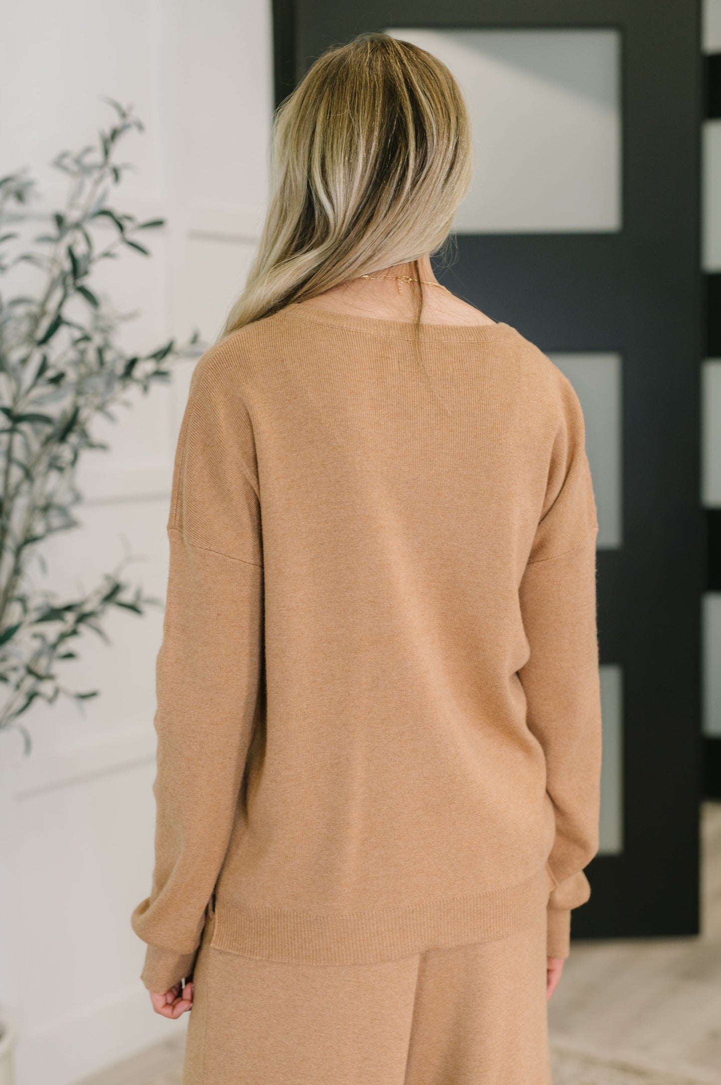 Close-up of ribbed knit texture on Clove Sweater in Camel neckline