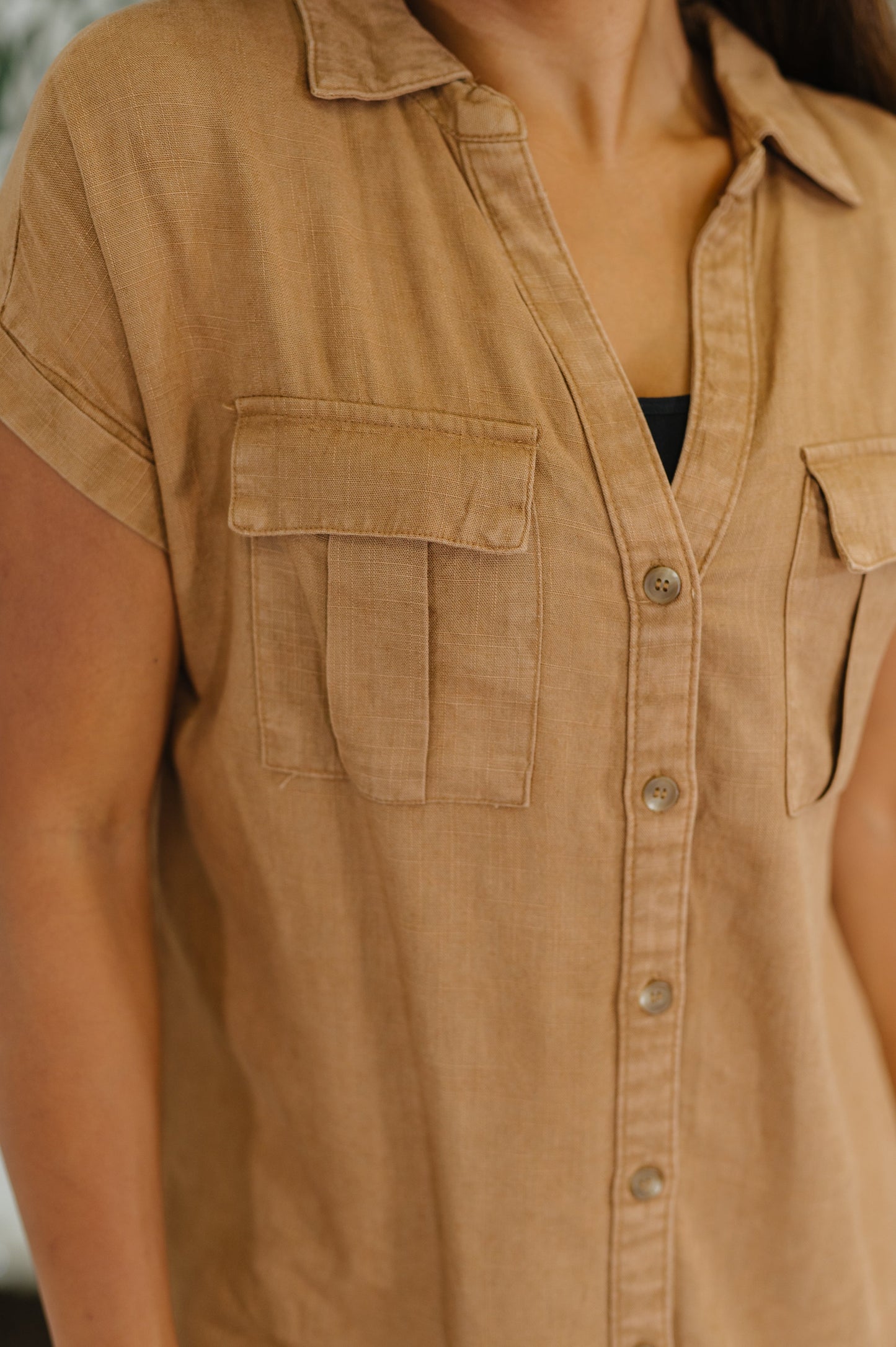 Close up of Waverly Blouse in deep camel showing button detail and pockets