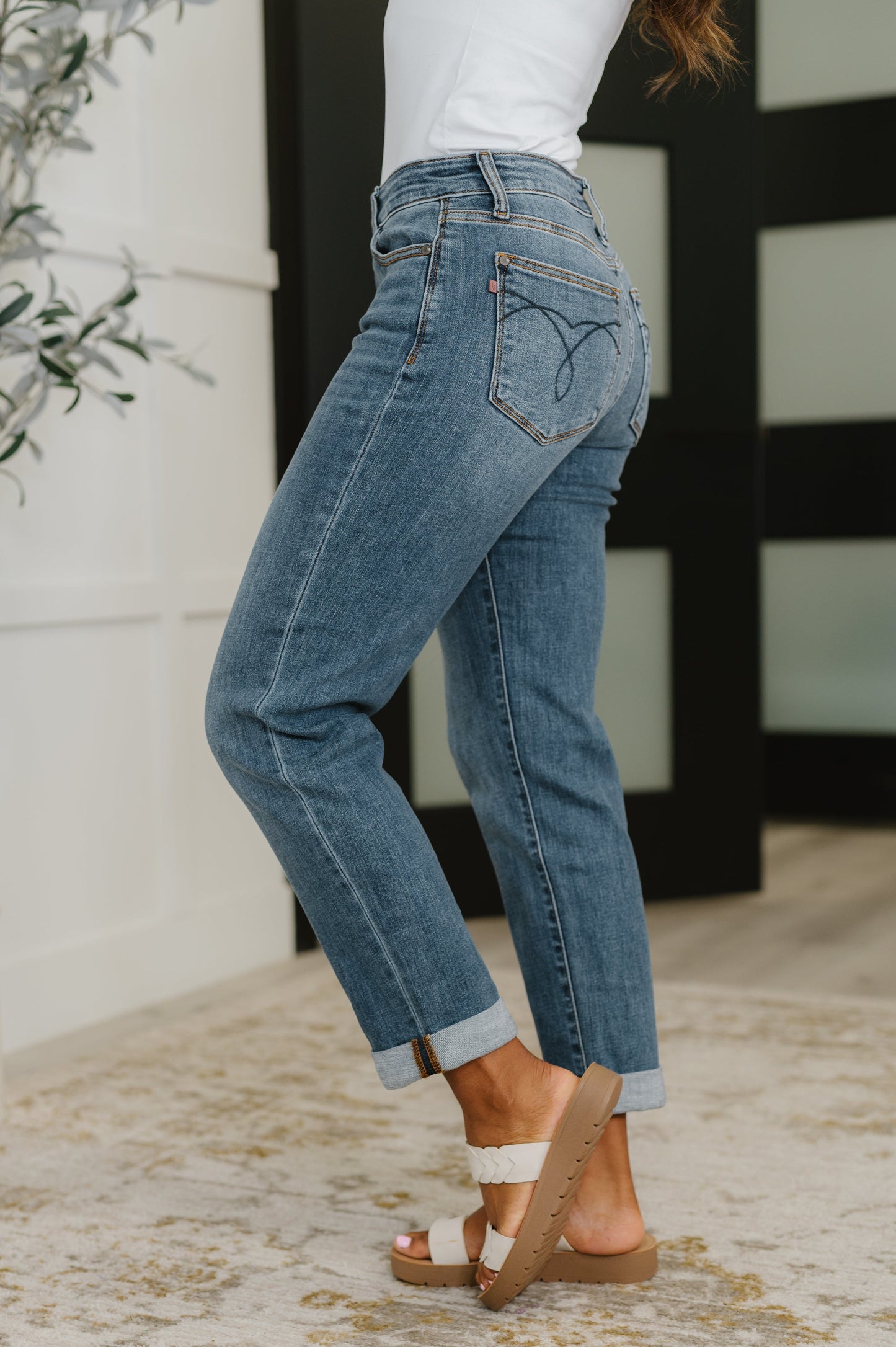 Side angle showcasing Judy Blue Colette Boyfriend Jeans, mid rise fit with 4-way stretch.
