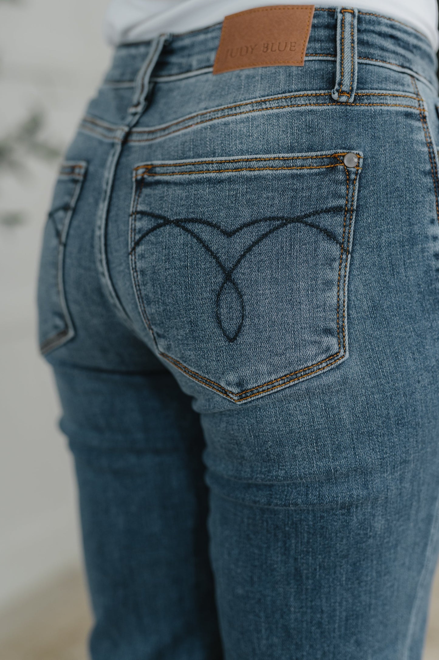 Close-up of Judy Blue Colette Mid Rise Boyfriend Jeans highlighting pocket and stretch denim.