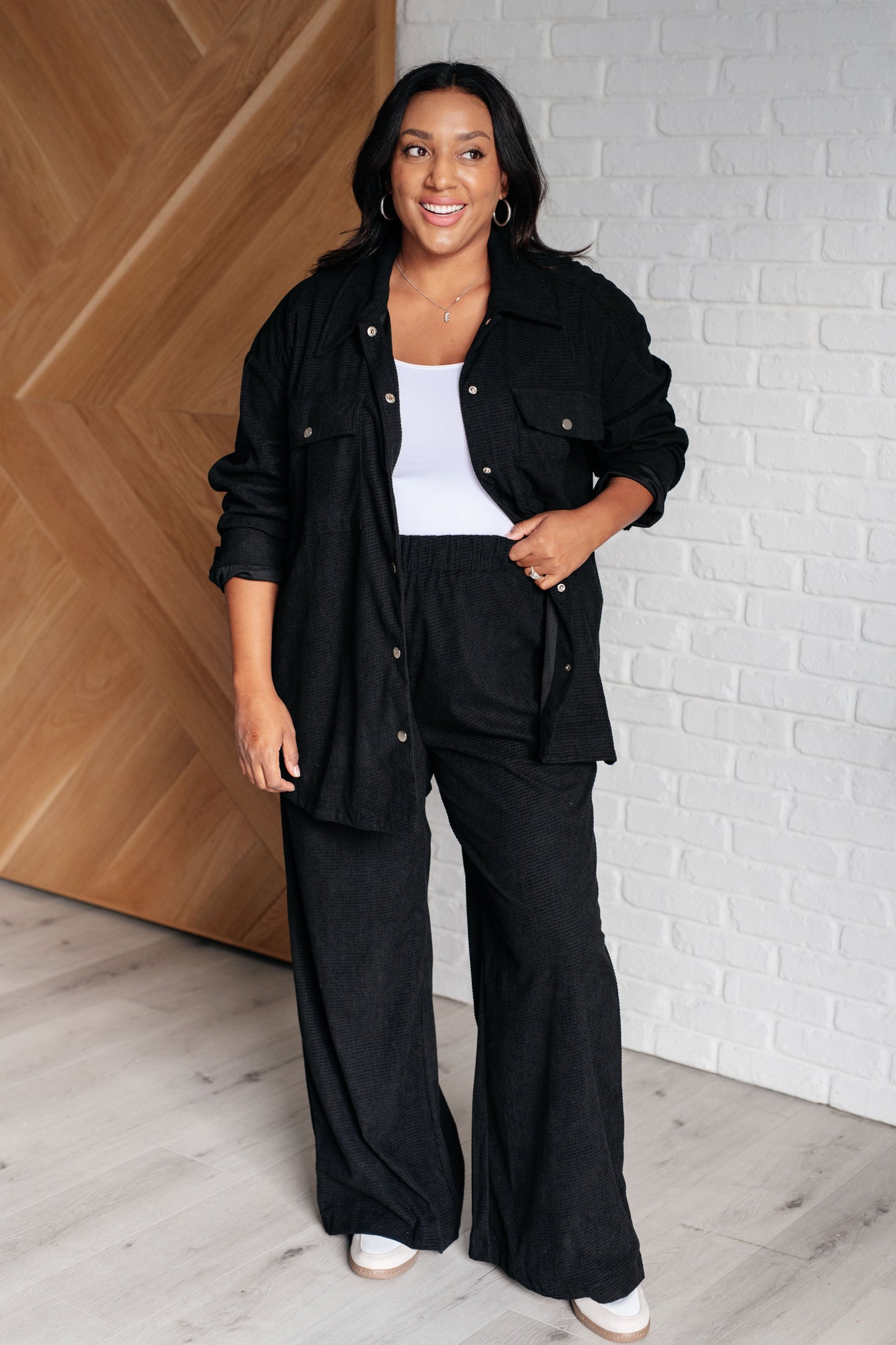 Plus size full body Alanna Button Down Top in black corduroy, layered over white tank