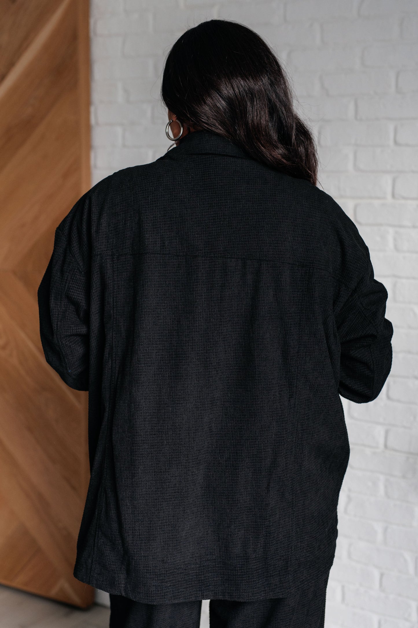 Plus size back view Alanna Button Down Top in black corduroy, longline oversized fit