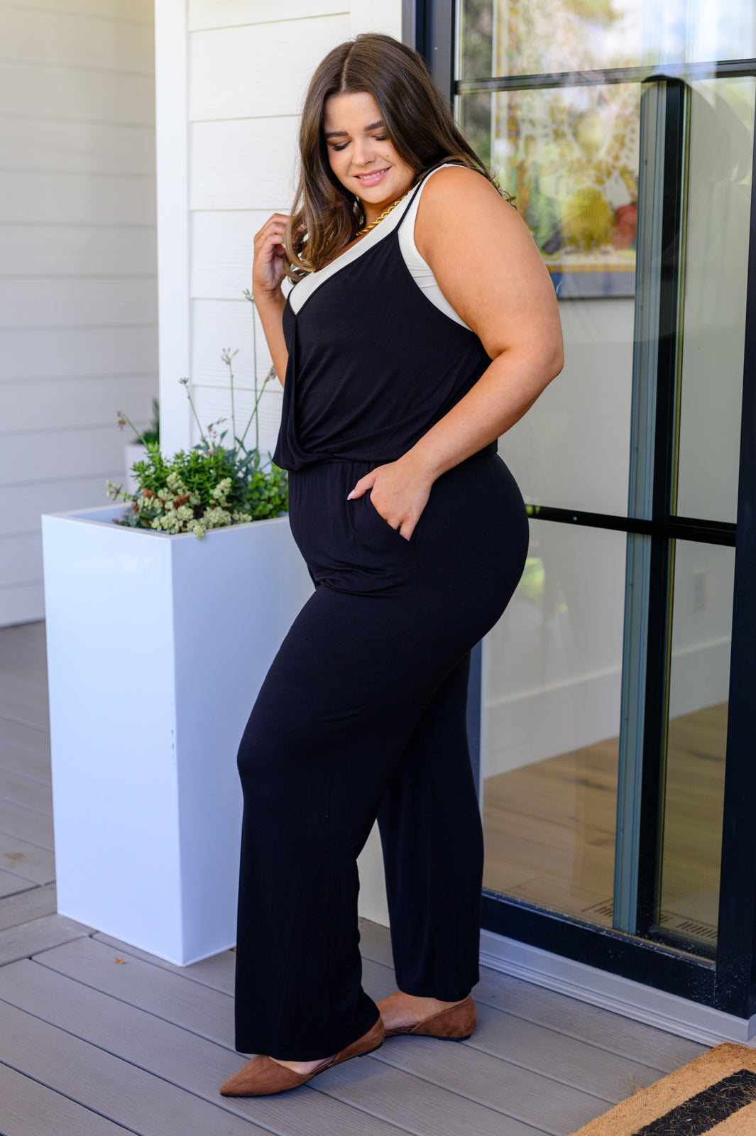 Plus size side view showing fit of Viola Jumpsuit in Black