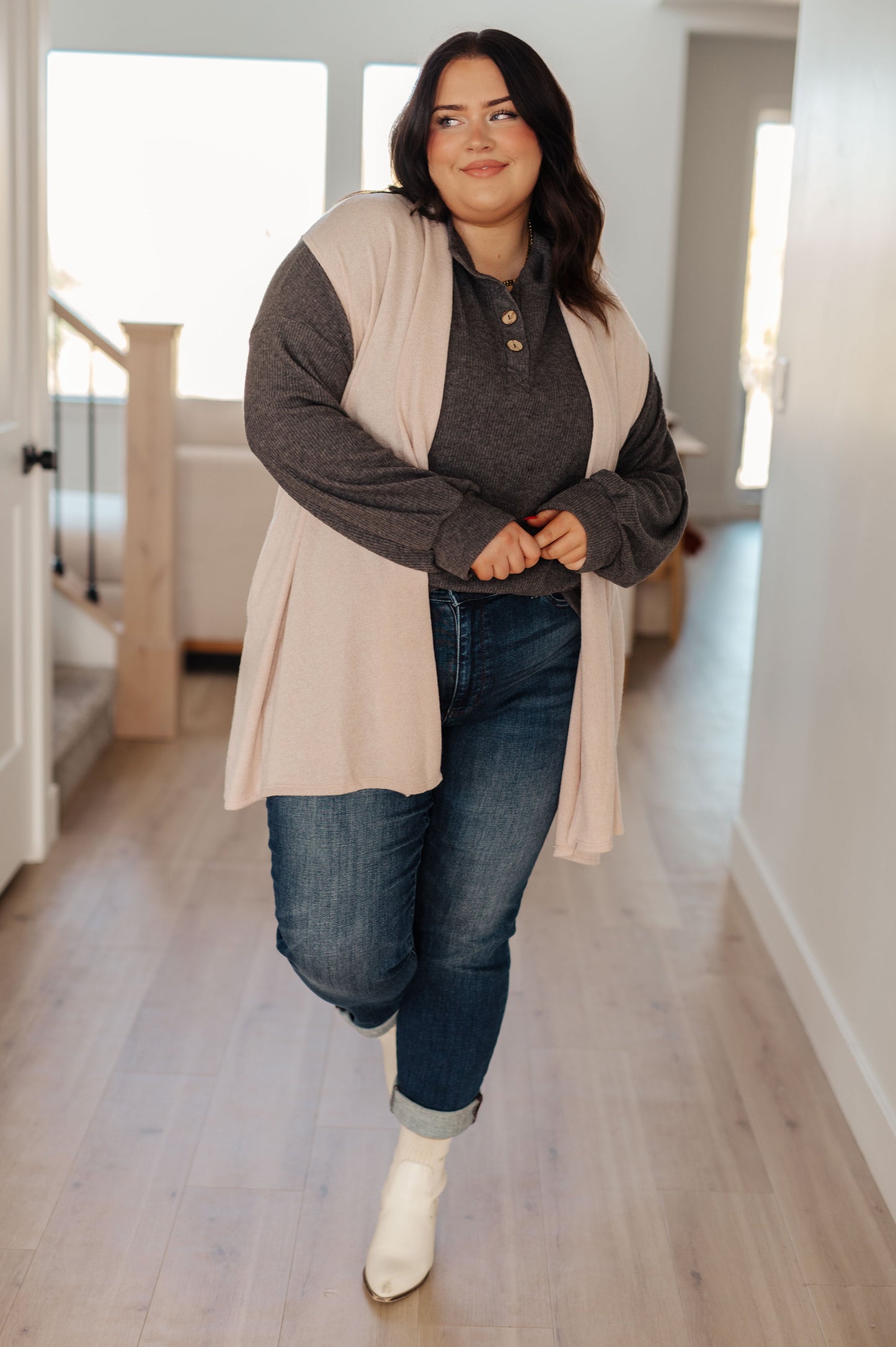 Plus size full body view of cream Priscilla Cardigan with sleeveless design, pockets, and shawl collar.