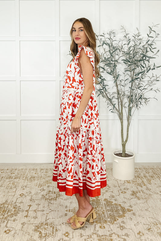 Side view of Daine Tiered Dress showing tiered layers and flutter sleeves in floral print.