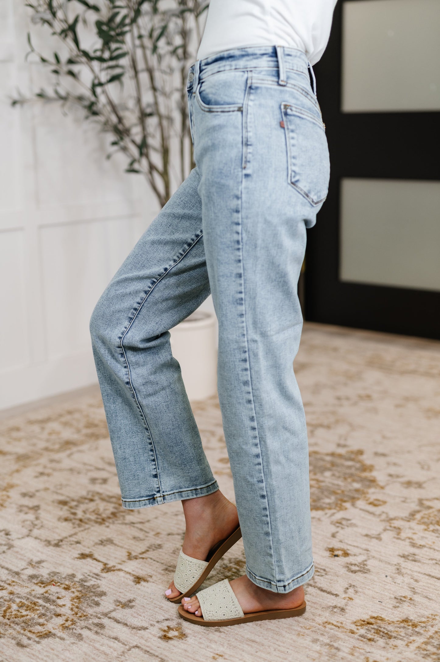 Debbie Judy Blue stone wash straight jeans, flattering high rise fit, side view.