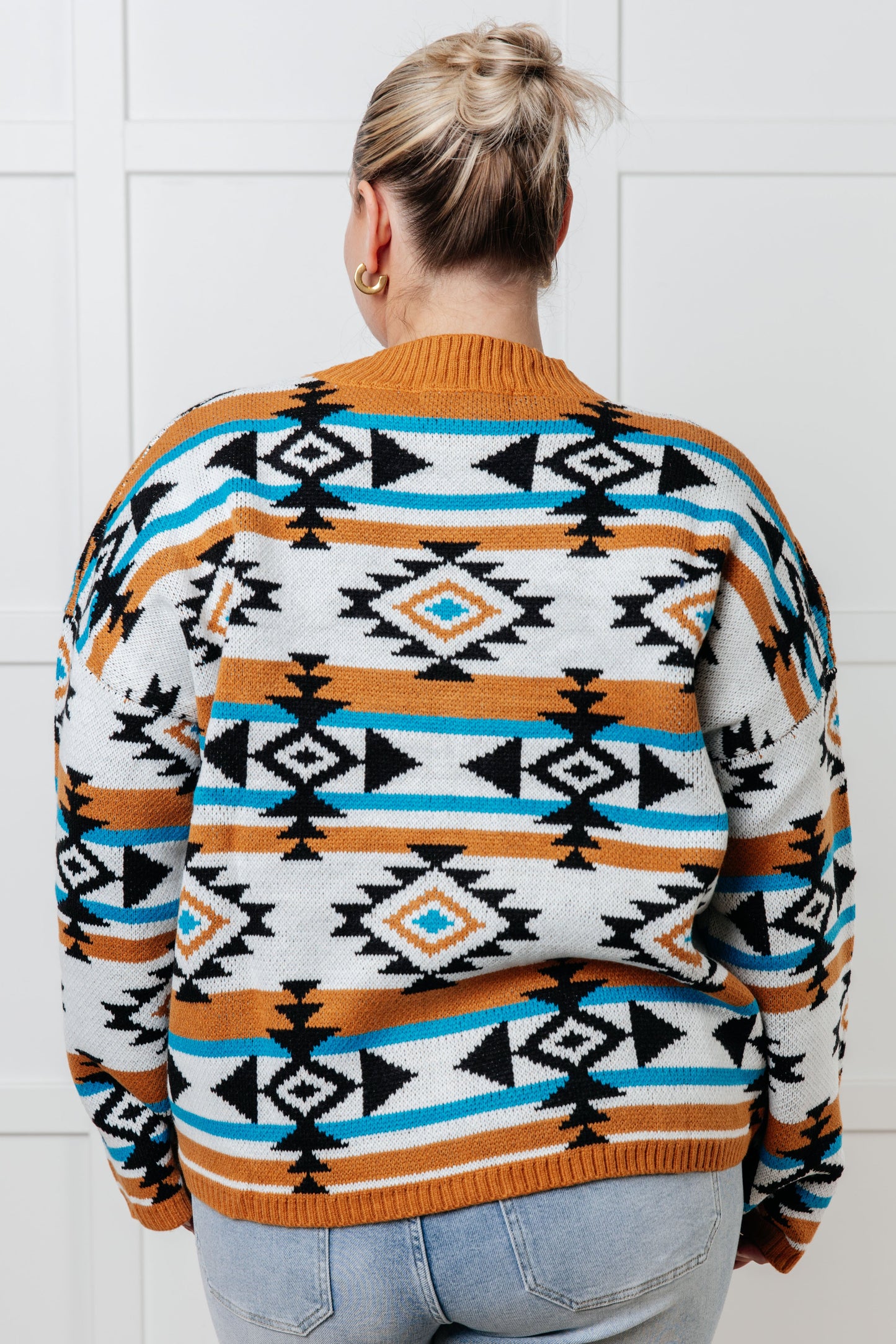 Plus size back view of Anza Geometric Striped Sweater highlighting geometric striped design