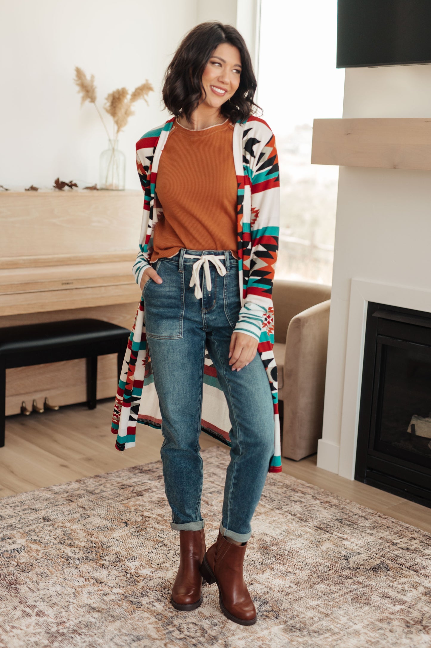 Full body view styling Joanna Waffle Knit Top with jeans and boots