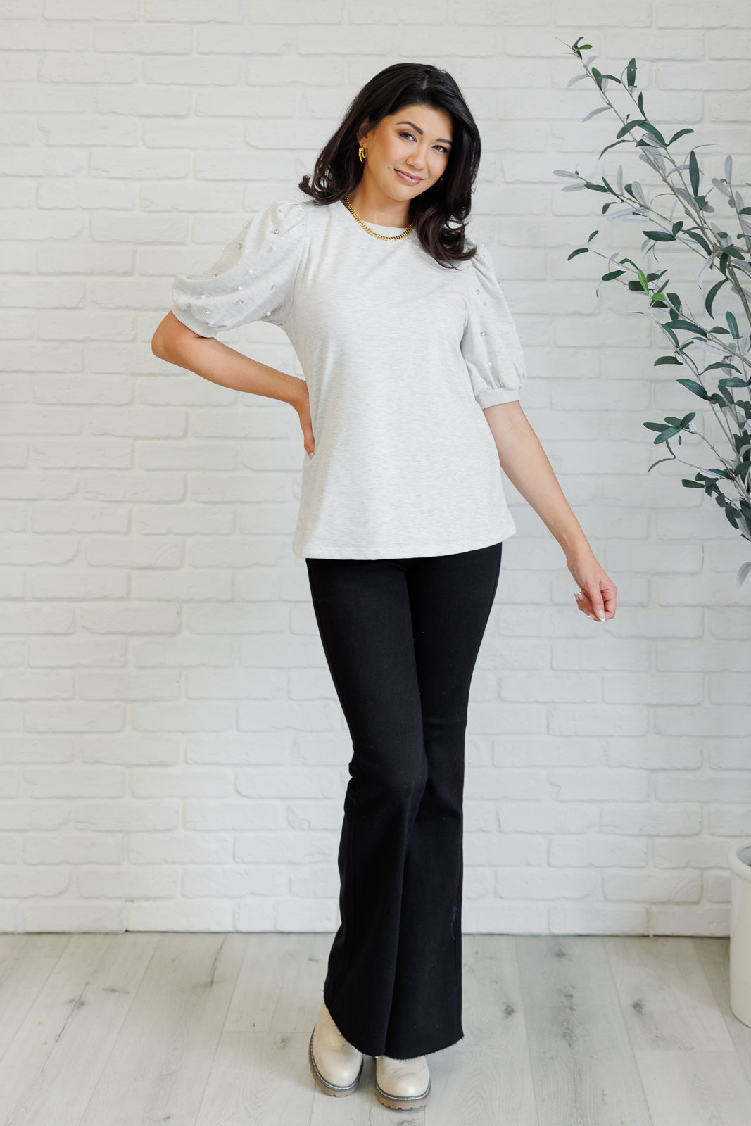 Light gray French terry top with a ribbed neckline, short balloon sleeves embellished with pearl and faux diamond accents, and ribbed sleeve cuffs.