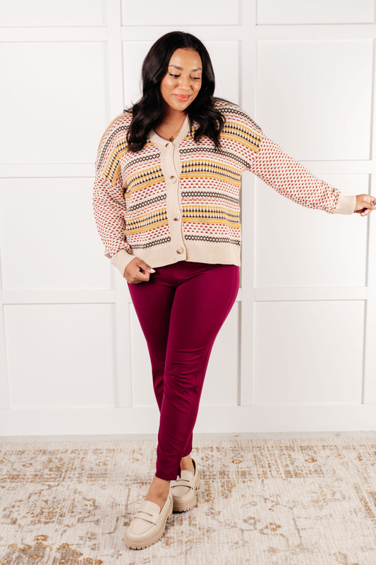Plus size front view of Ellie Striped Cardigan in cream with mustard, rust, and brown stripes, button front closure.