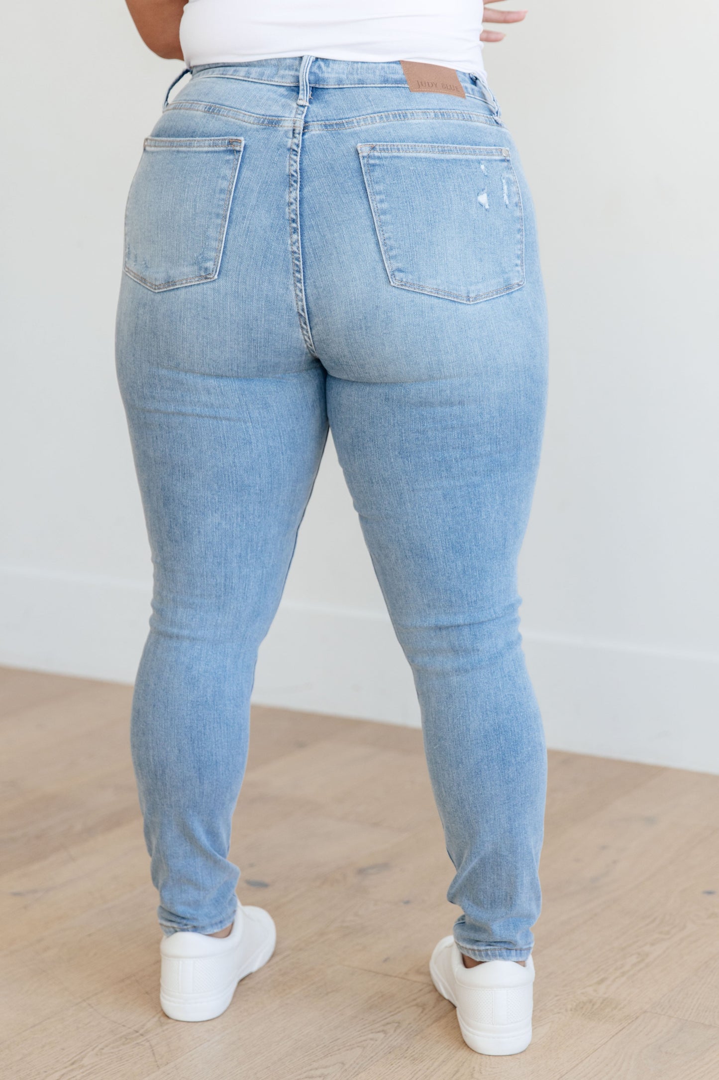 Plus back view Eloise jeans in light wash with contoured fit and distressing