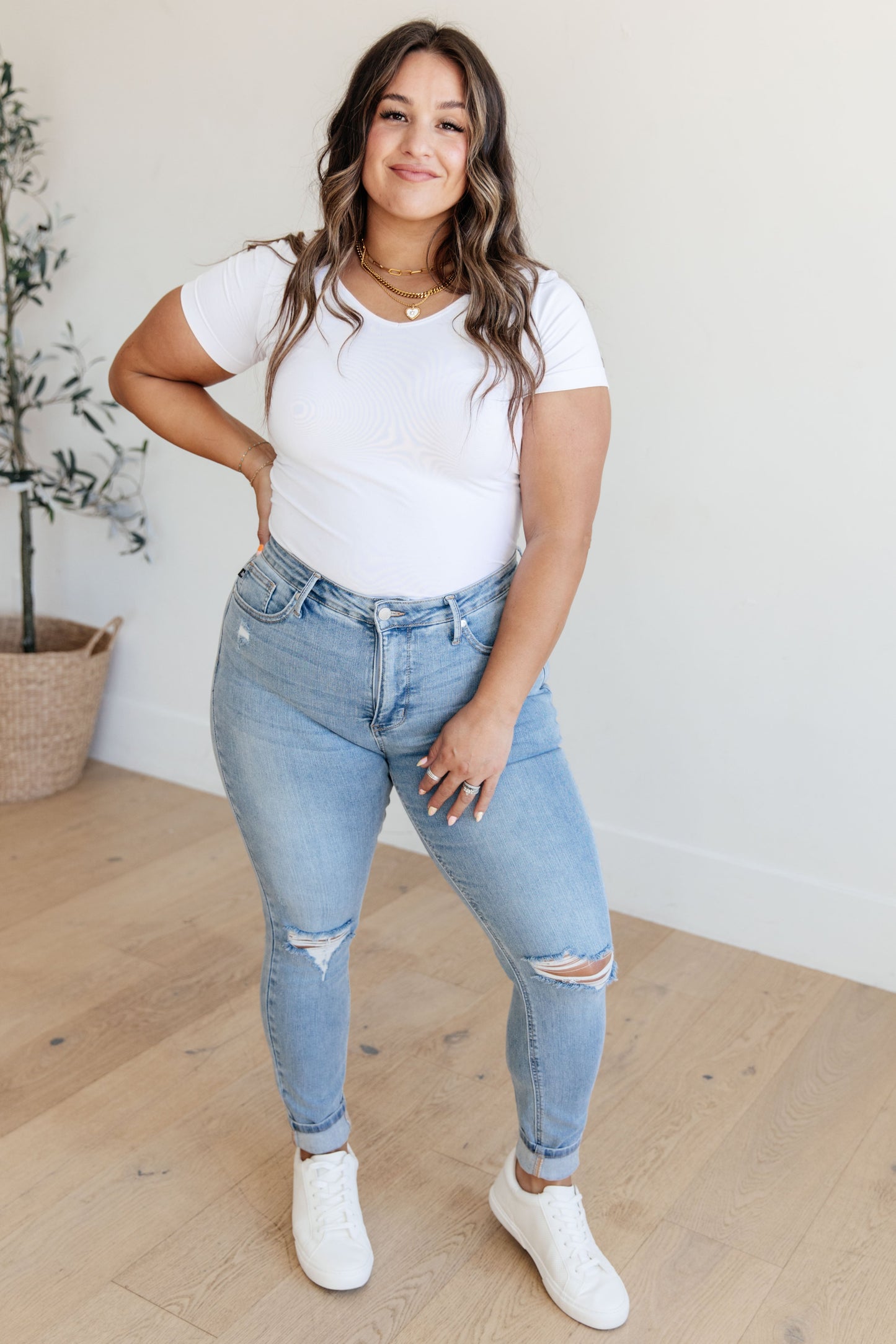 Plus full body view Eloise jeans showing mid rise fit and slim silhouette