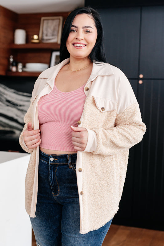 Plus size model wearing Endee Sherpa Shacket in cream with collared neckline.