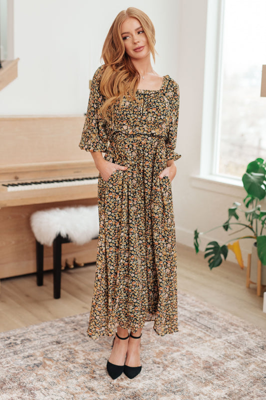 Everette maxi dress in ditsy floral print with square neckline, flowing hem, full body.