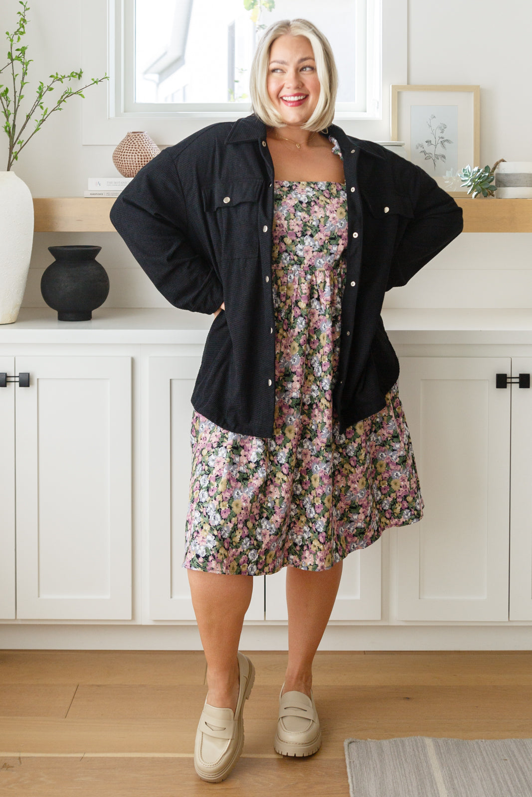 Plus size full body view of Skyla Floral Dress showing smocked bodice and puff sleeves.