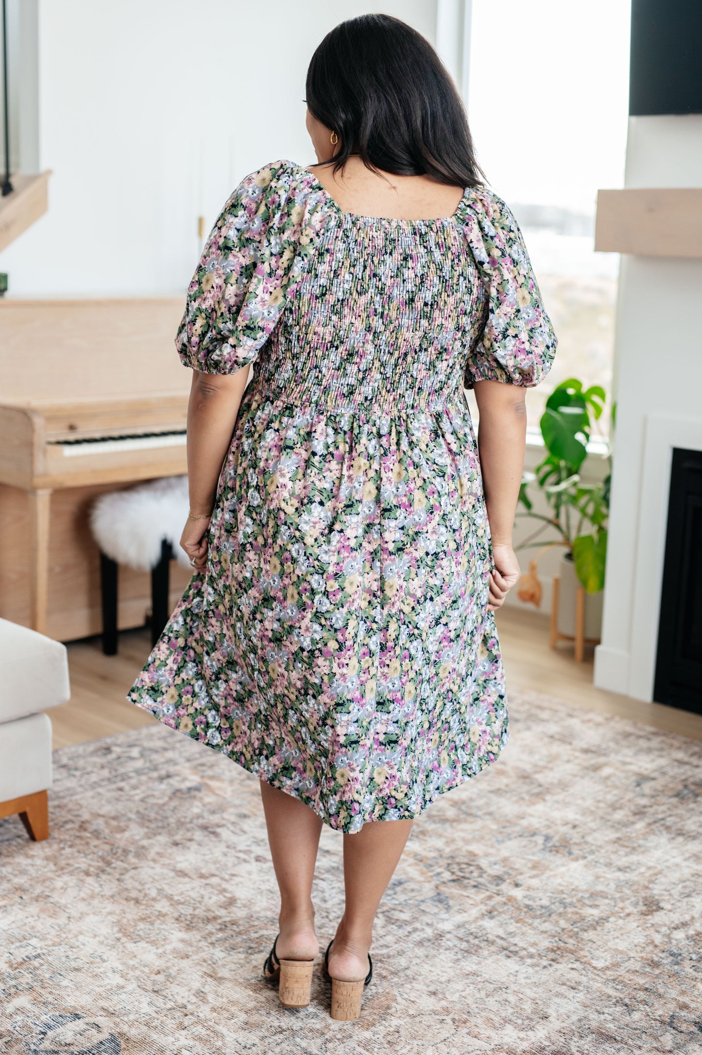 Plus size back view of Skyla Floral Dress showing smocked elastic back and puff sleeves.