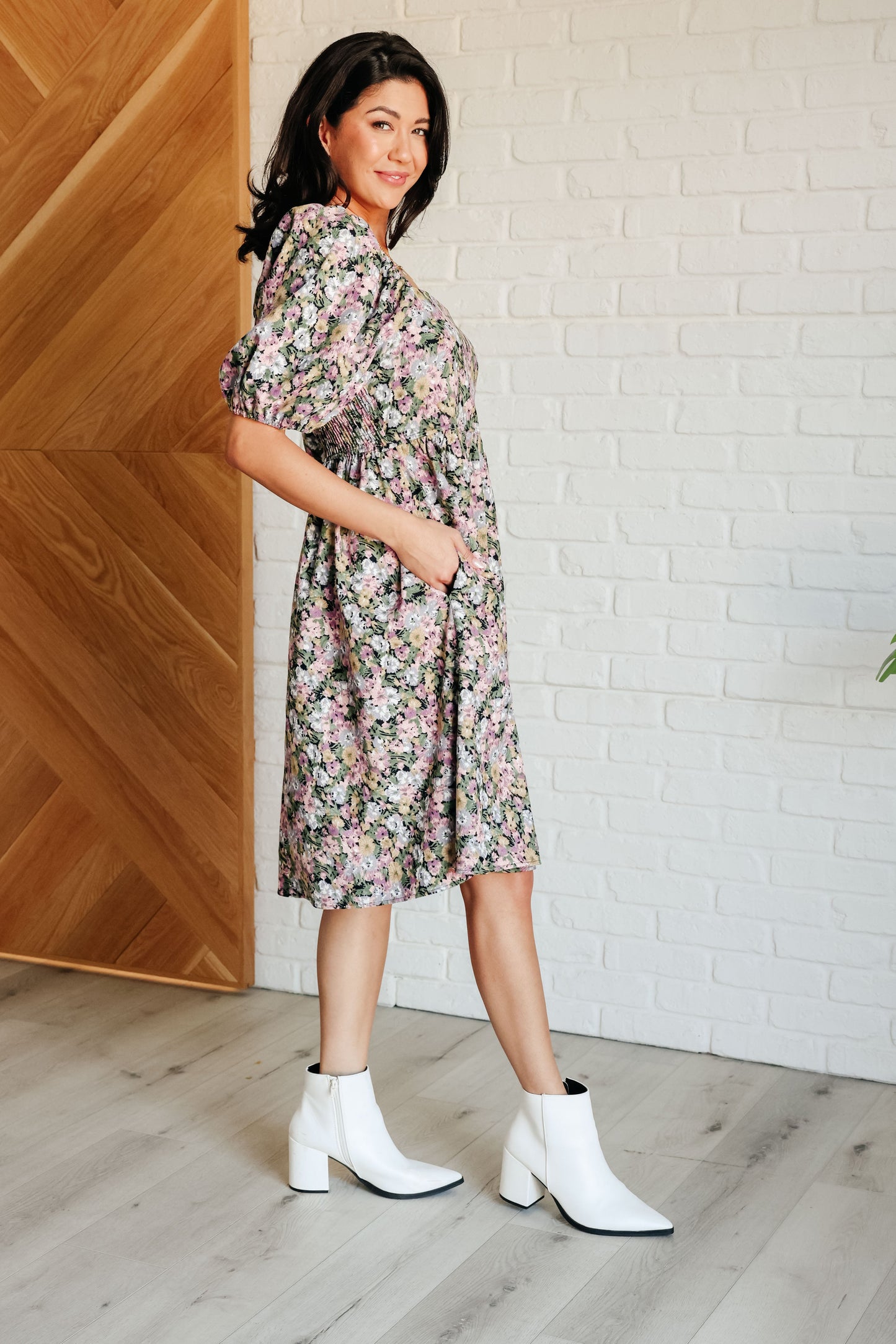 Side view of Skyla Floral Dress featuring babydoll silhouette and floral pattern.
