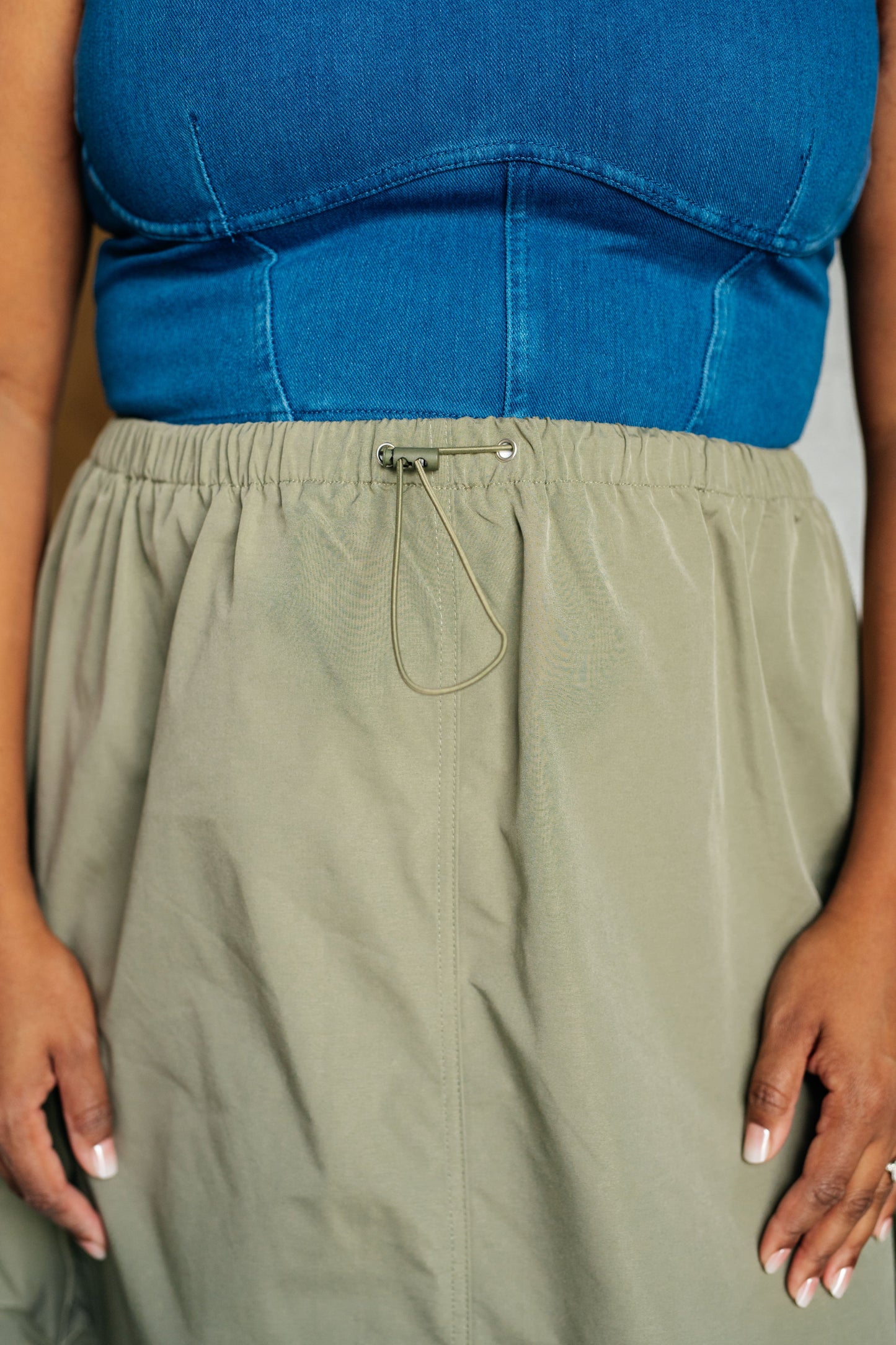 Bodhi Cargo Skirt close up view of khaki fabric and draw string details