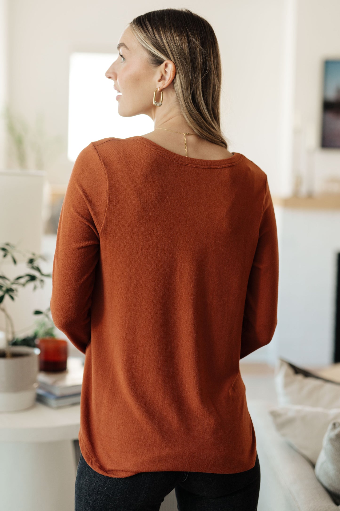 Back of Dacia Scoop Neck Top in pumpkin, brushed knit fabric with relaxed fit