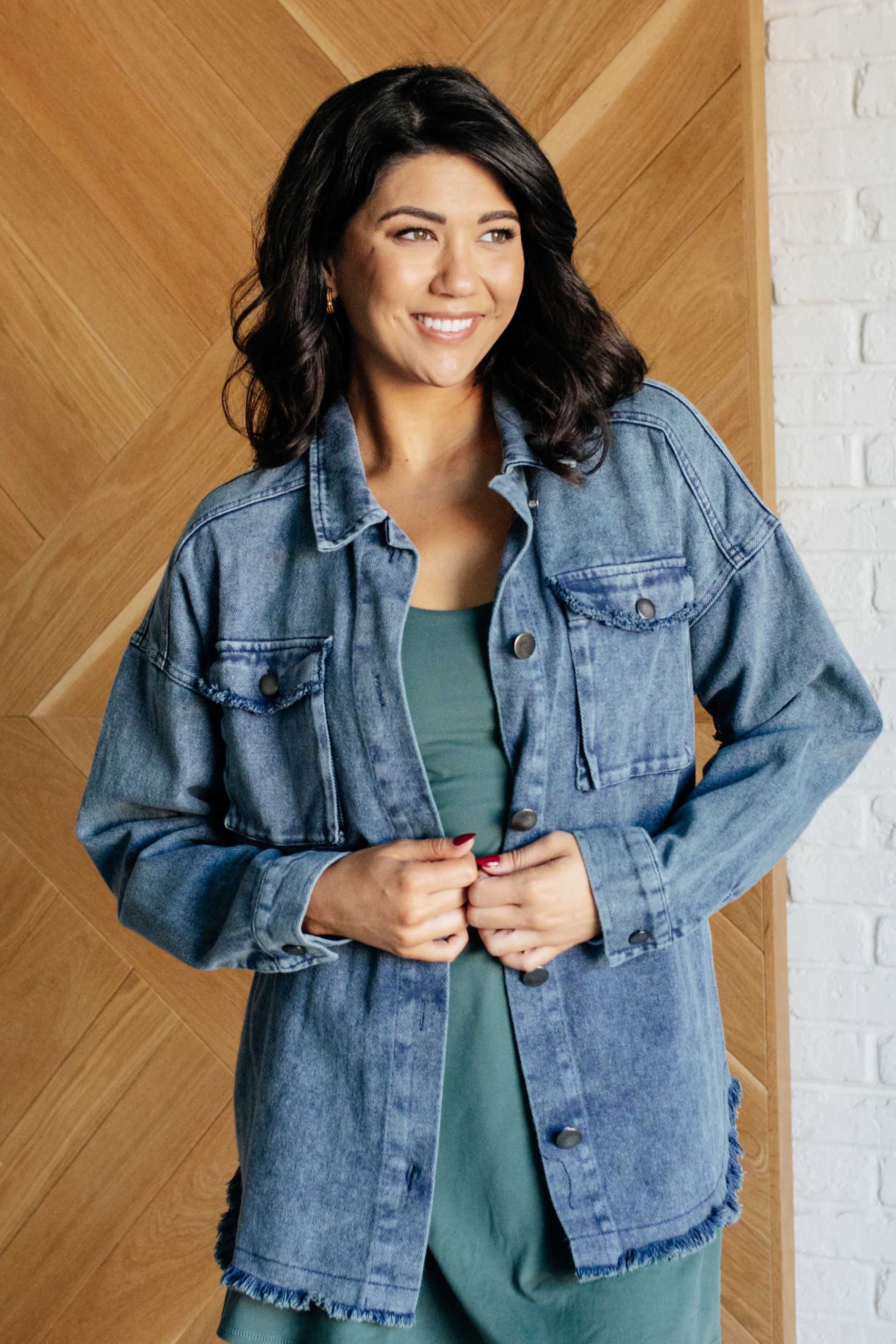 Front view of Fernanda Mineral Wash Shacket with collared neckline, button front, gusseted pocket, and raw hem detail.
