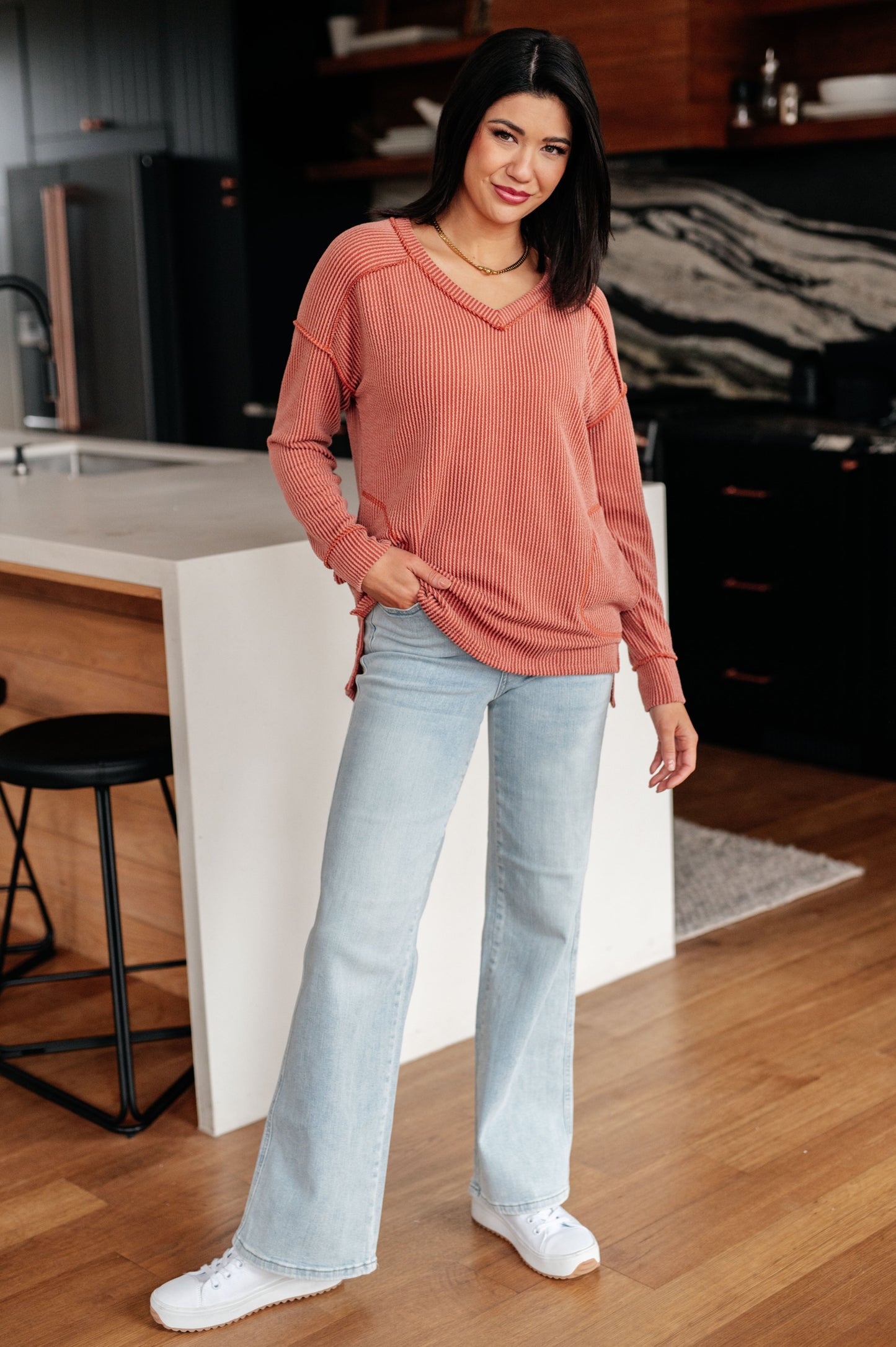 Full body Molly Rib Knit Top styled with jacket and jeans for layered look