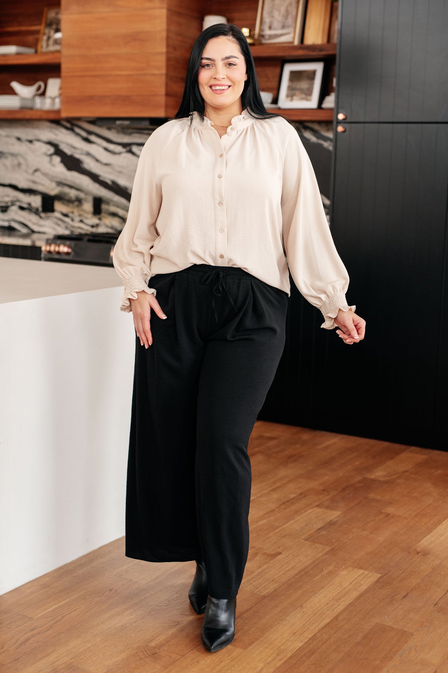 Model wearing plus size Florence Blouse cream crinkle woven fabric front.
