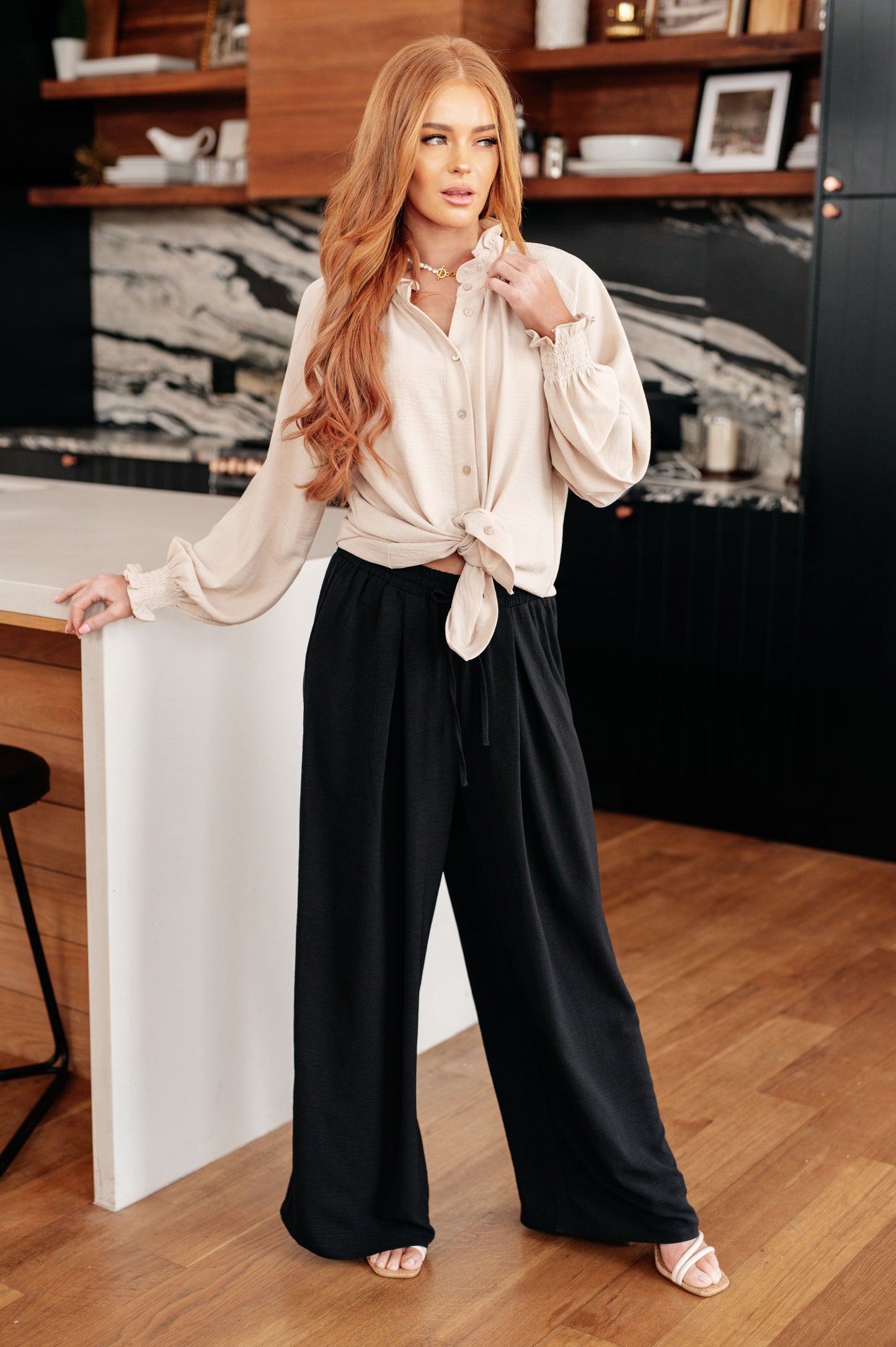 Model wearing Florence Button Up Blouse cream long sleeves front view.