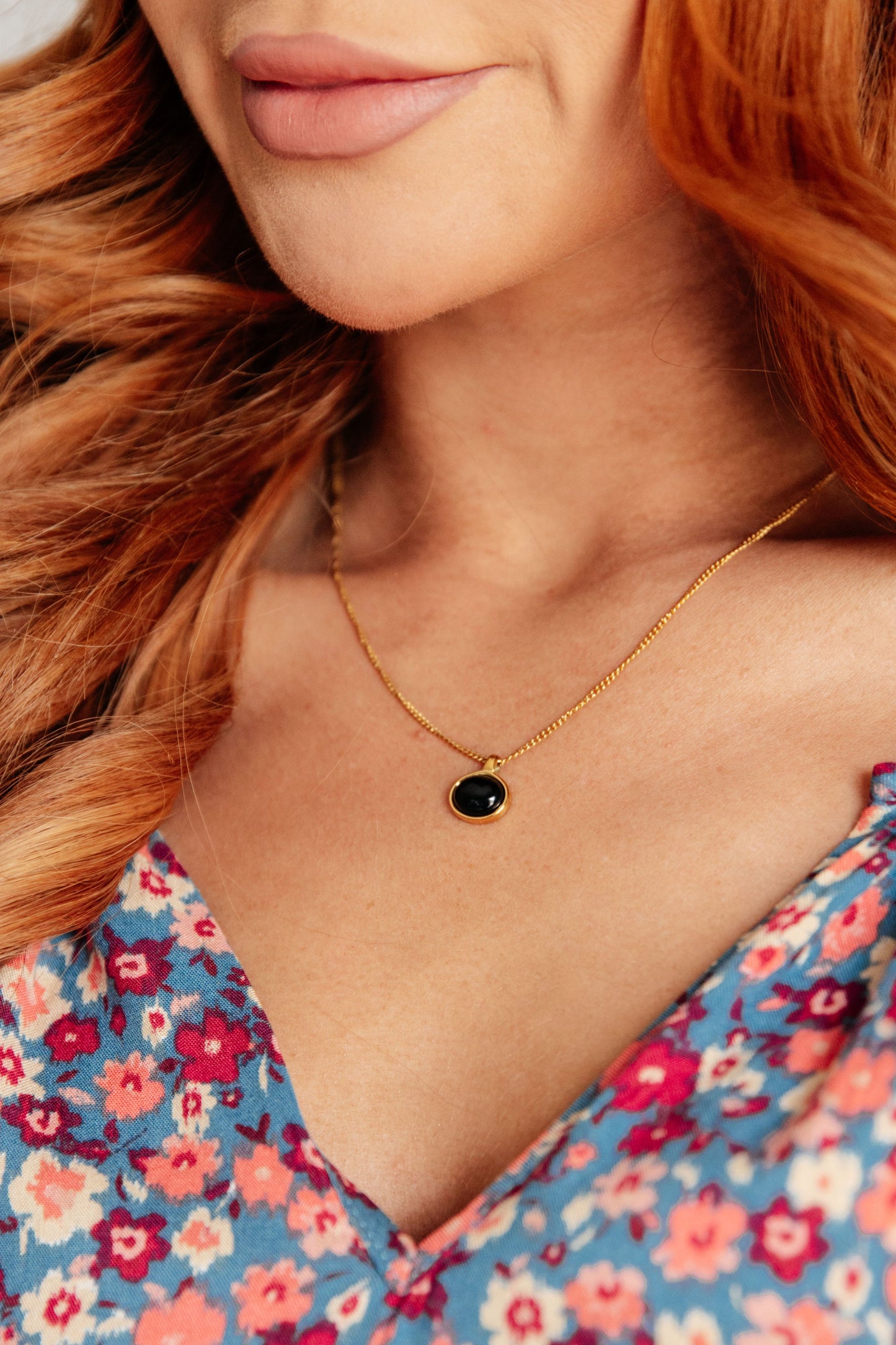 Model wearing The Promise necklace, CZ tennis chain sparkling against neckline.