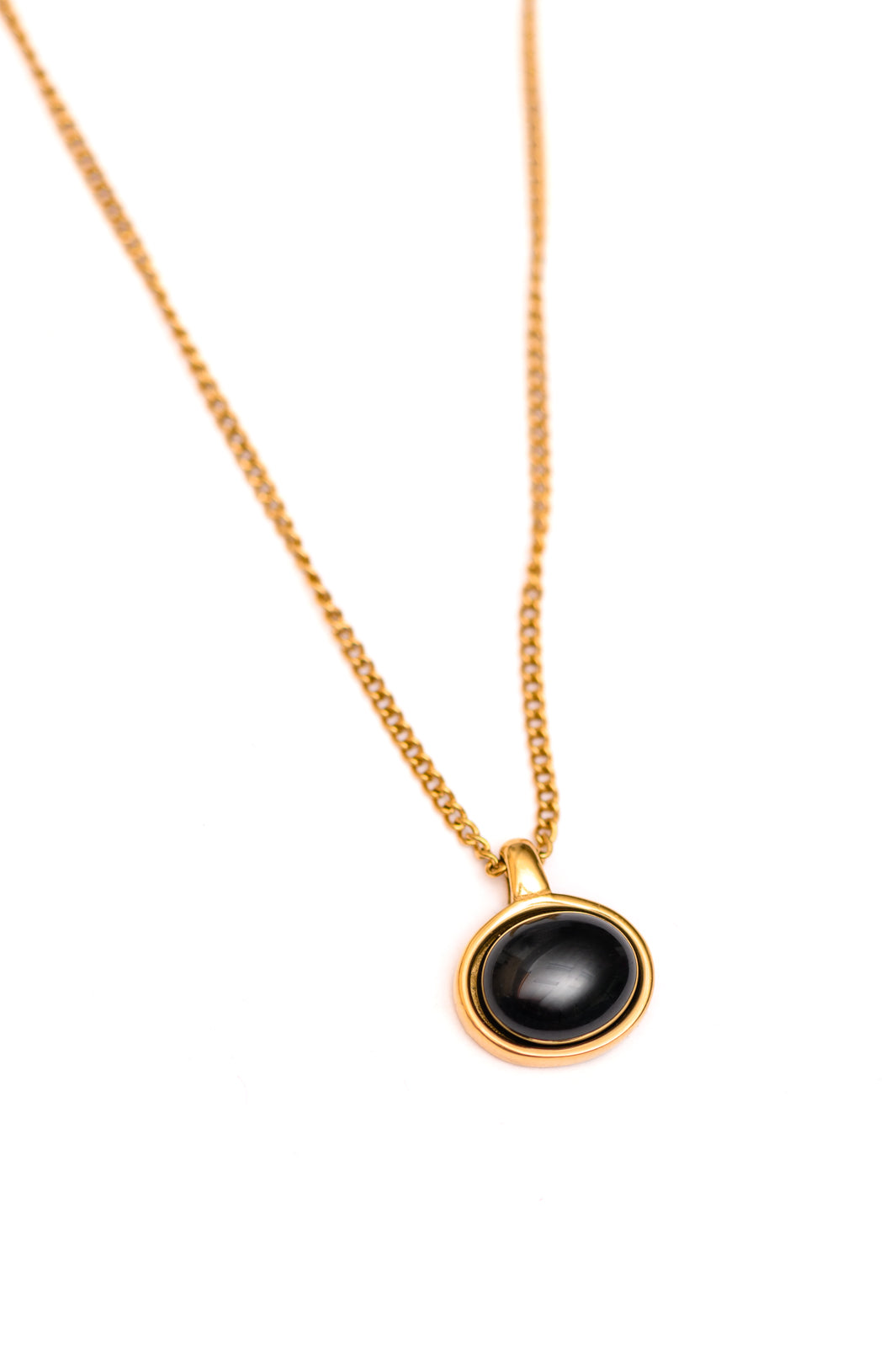 Close-up of The Promise necklace with 18K gold-plated tennis chain and cubic zirconia stones.