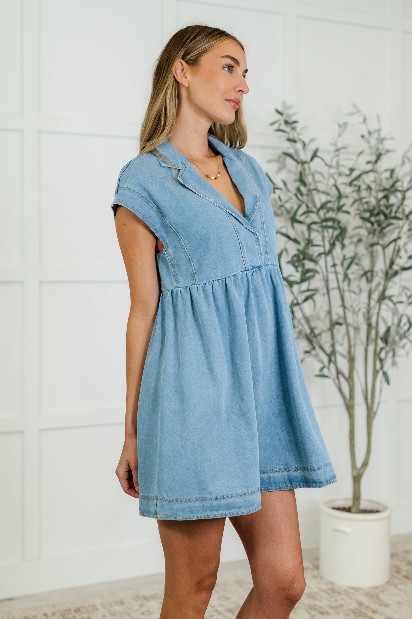 Western inspired denim dress with short sleeves and snap front – perfect for everyday wear.