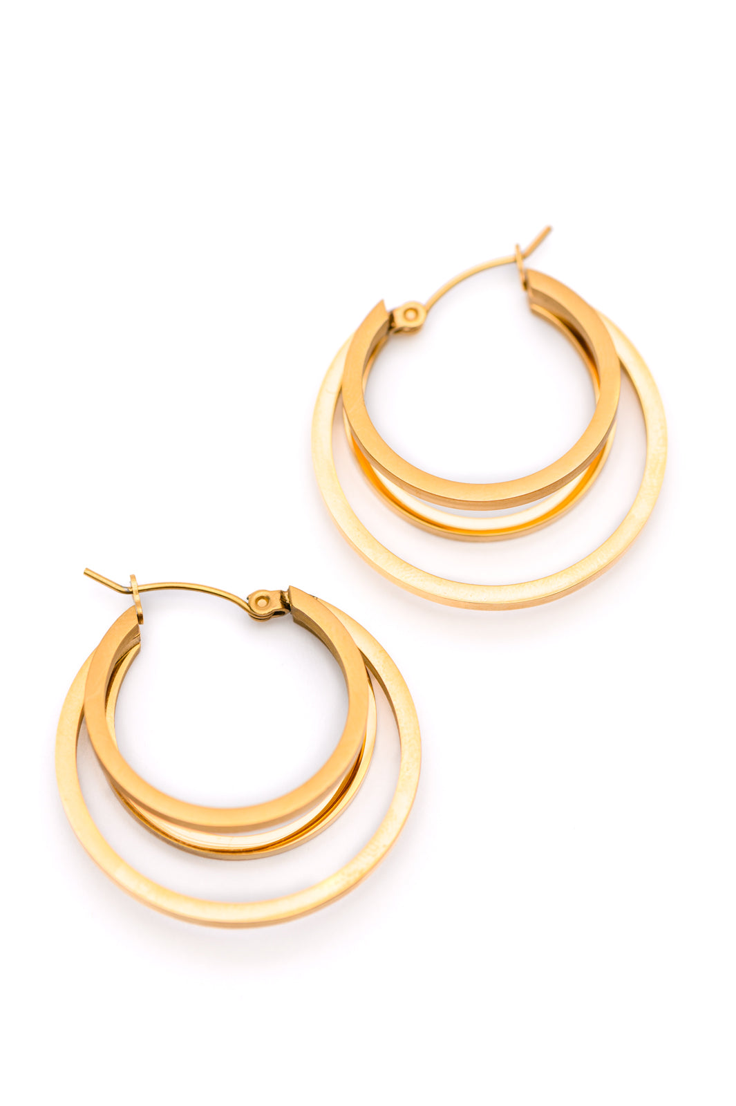 Flat lay of Get In Line Hoops showing 18K gold-plated double layer design with saddleback closure.
