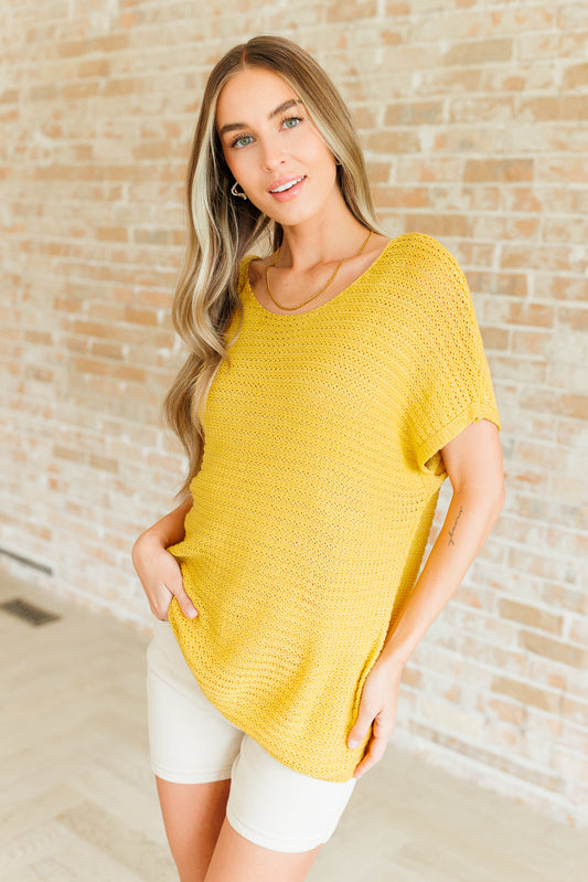 Saffron Eliora Knit Top with scoop neck, short dolman sleeves, and ribbed hemline for chic spring style.