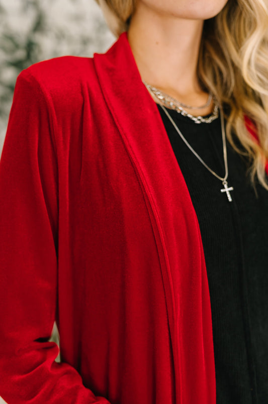 Close-up of Harley Long Velvet Cardigan showing rich red velvet knit texture.