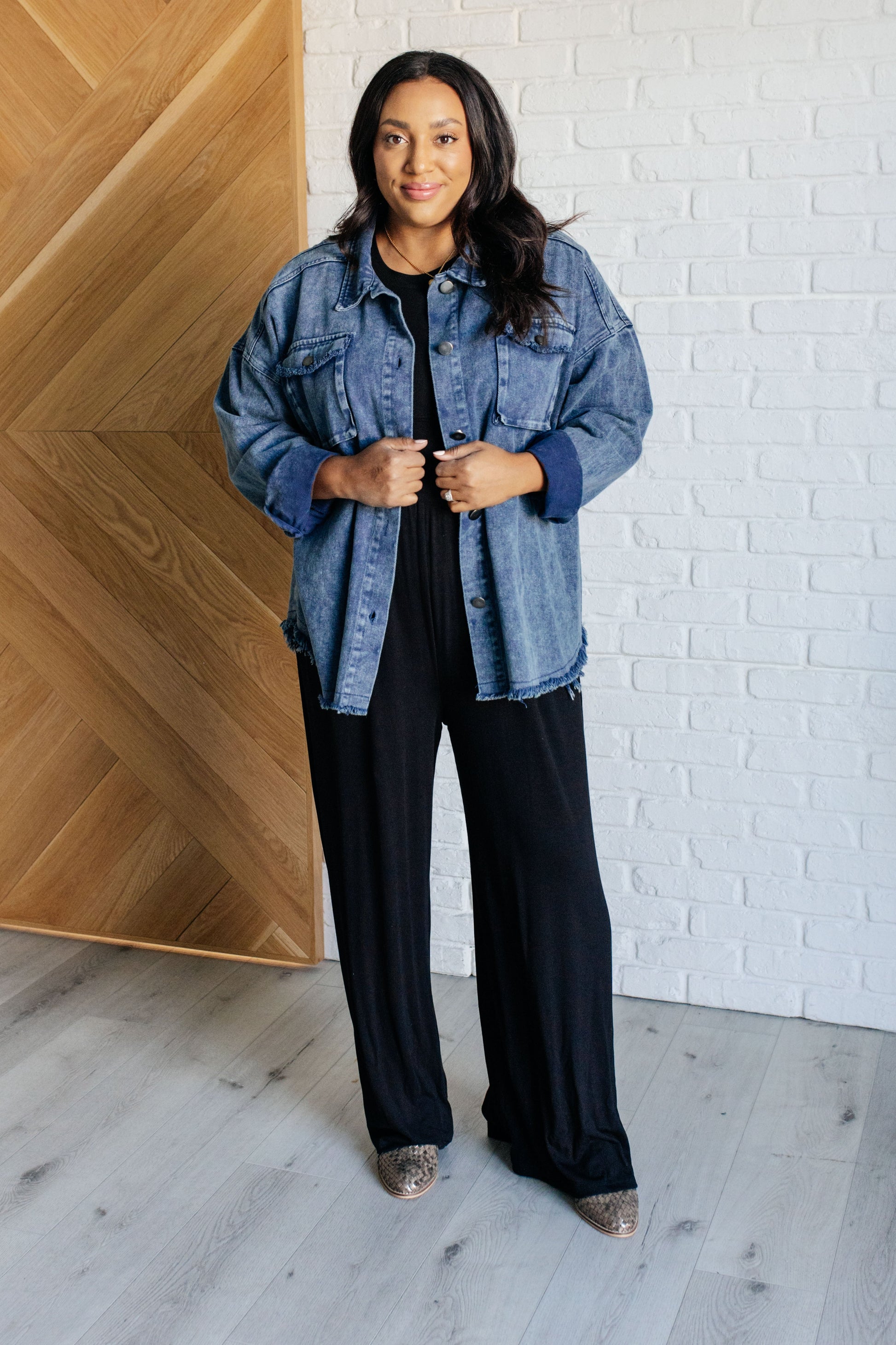 Plus size full body view of Fernanda Mineral Wash Shacket showing medium wash denim with raw edges.