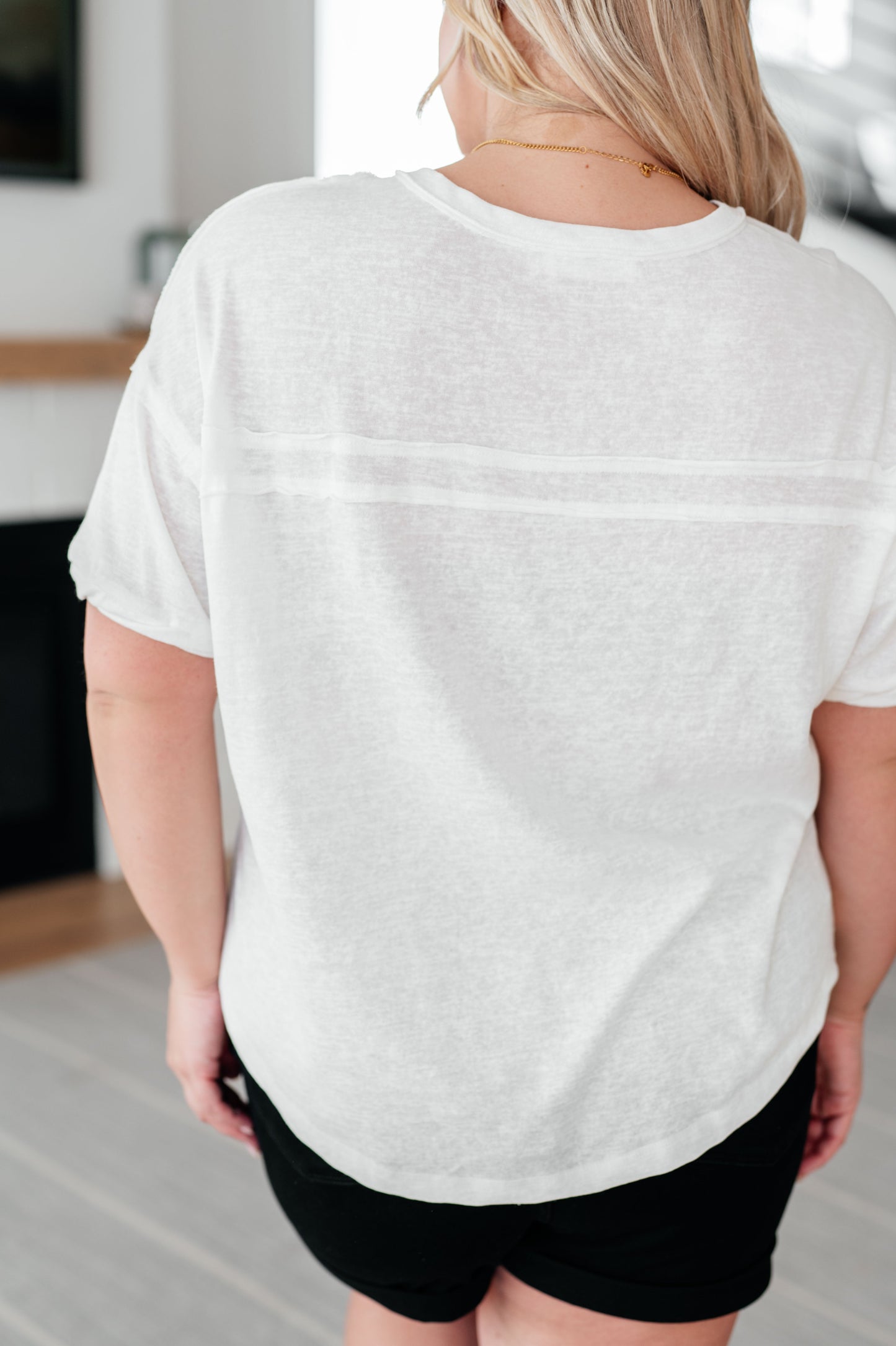 Plus size back view of Khloe Henley Top in ivory, showcasing the relaxed fit and scooped high-low hemline.