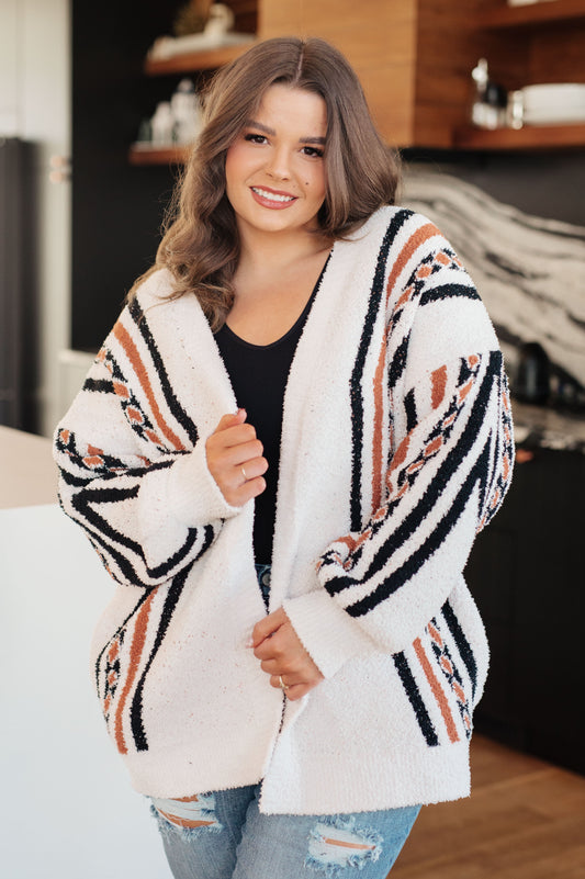 Plus size model wearing Hollis Aztec Print Cardigan in white with open front design.