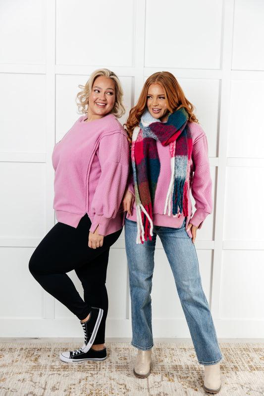 Two models wearing Danna Fleece Pullover in pink, styled with jeans and leggings